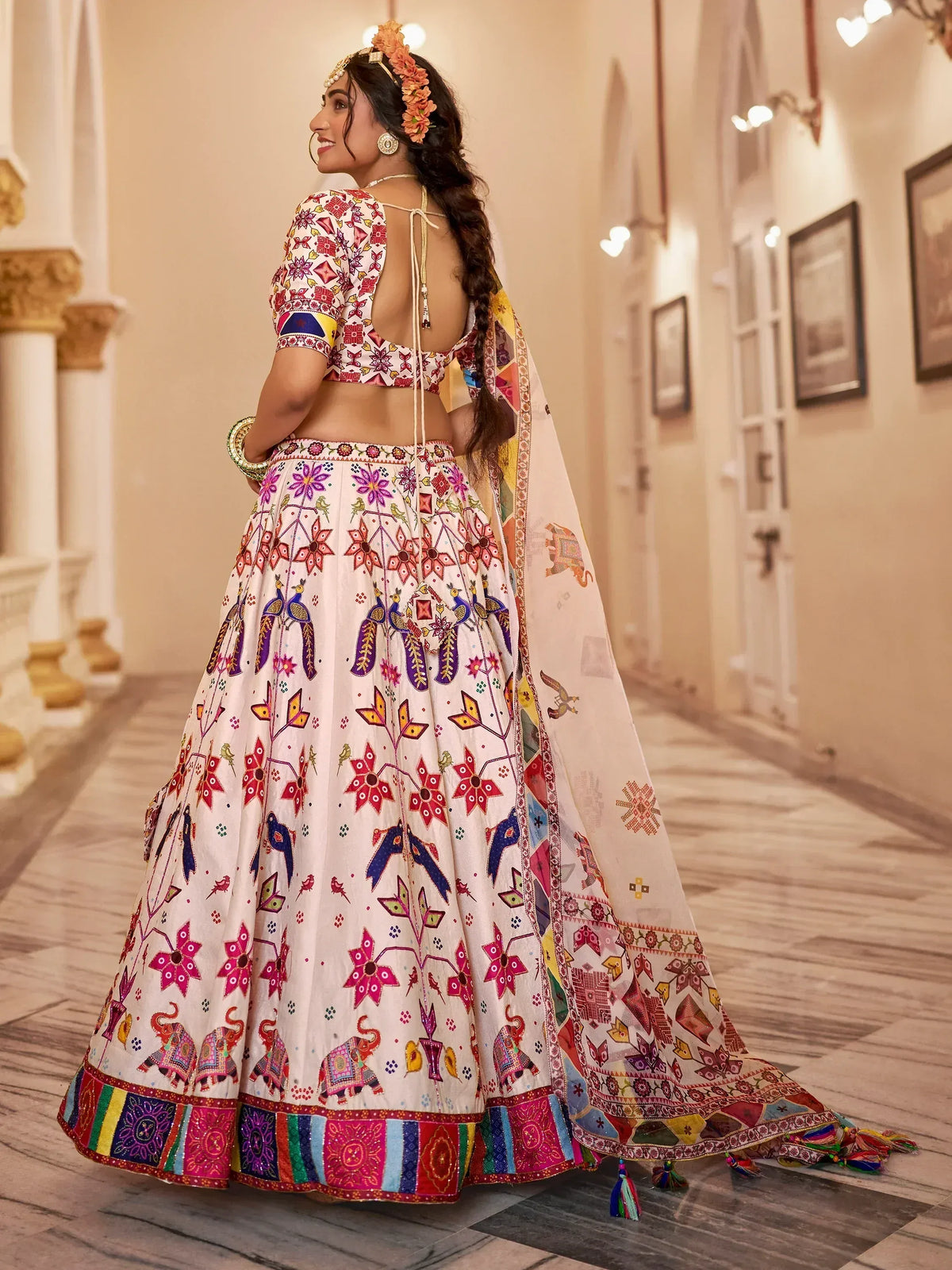 Colorful Indian lehenga choli with floral and peacock print, perfect for ethnic occasions and weddings.