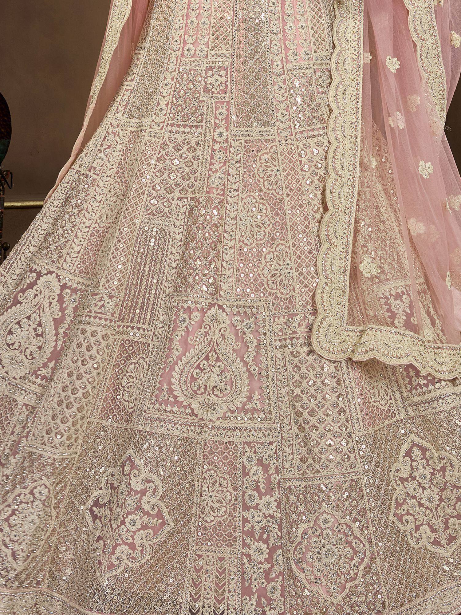 Pink designer lehenga choli with intricate gold embroidery and sequin work, perfect for weddings and festivals.