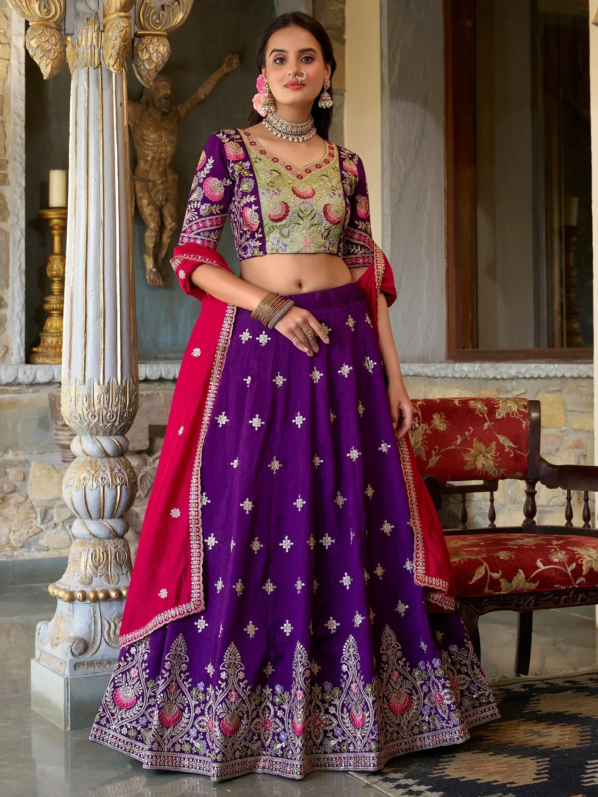 Purple and green embroidered lehenga choli with floral motifs, perfect for Indian ethnic wear occasions.