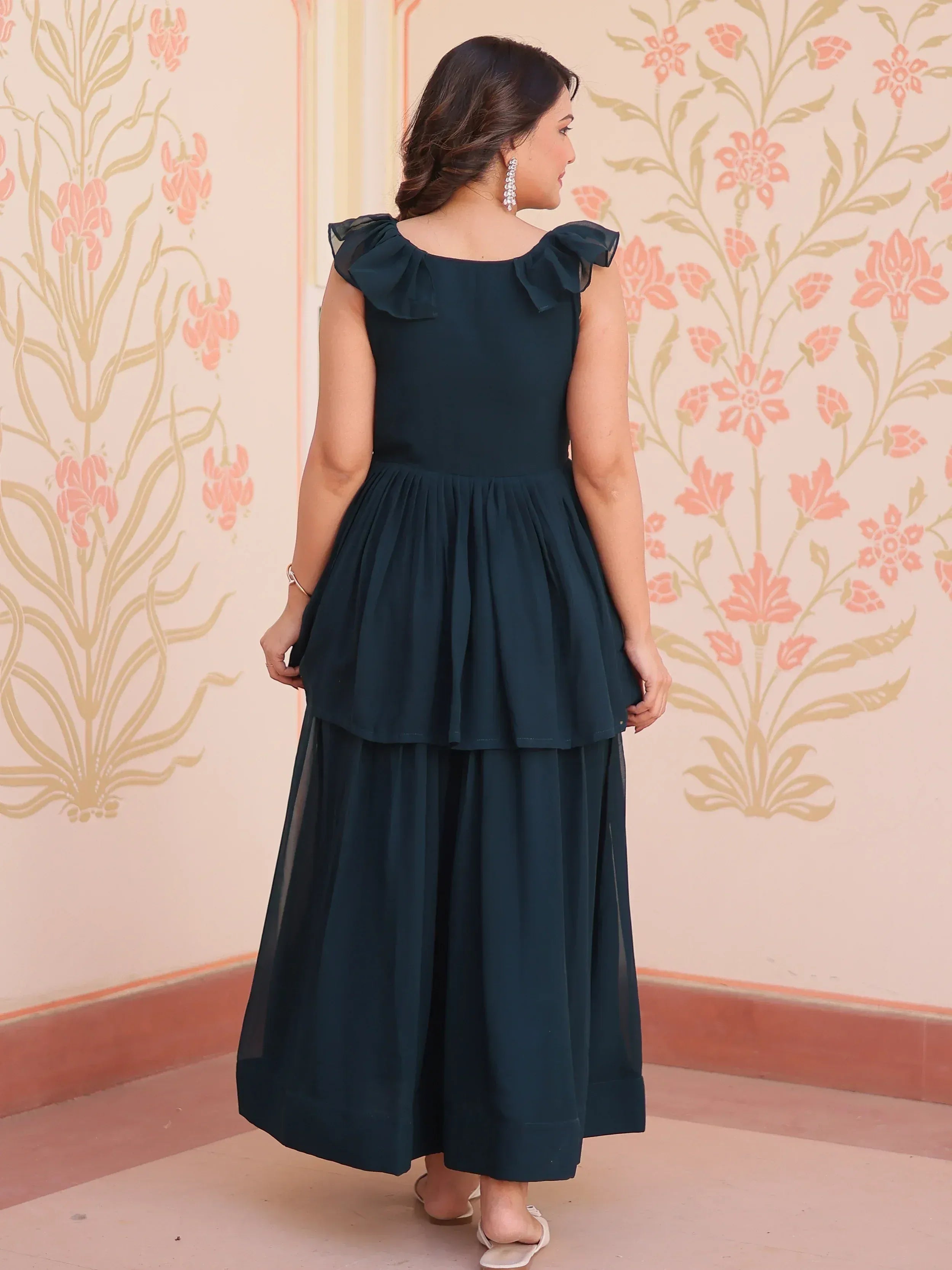 Dark green ethnic gown with ruffle shoulders and tiered skirt, perfect for Indian occasions
