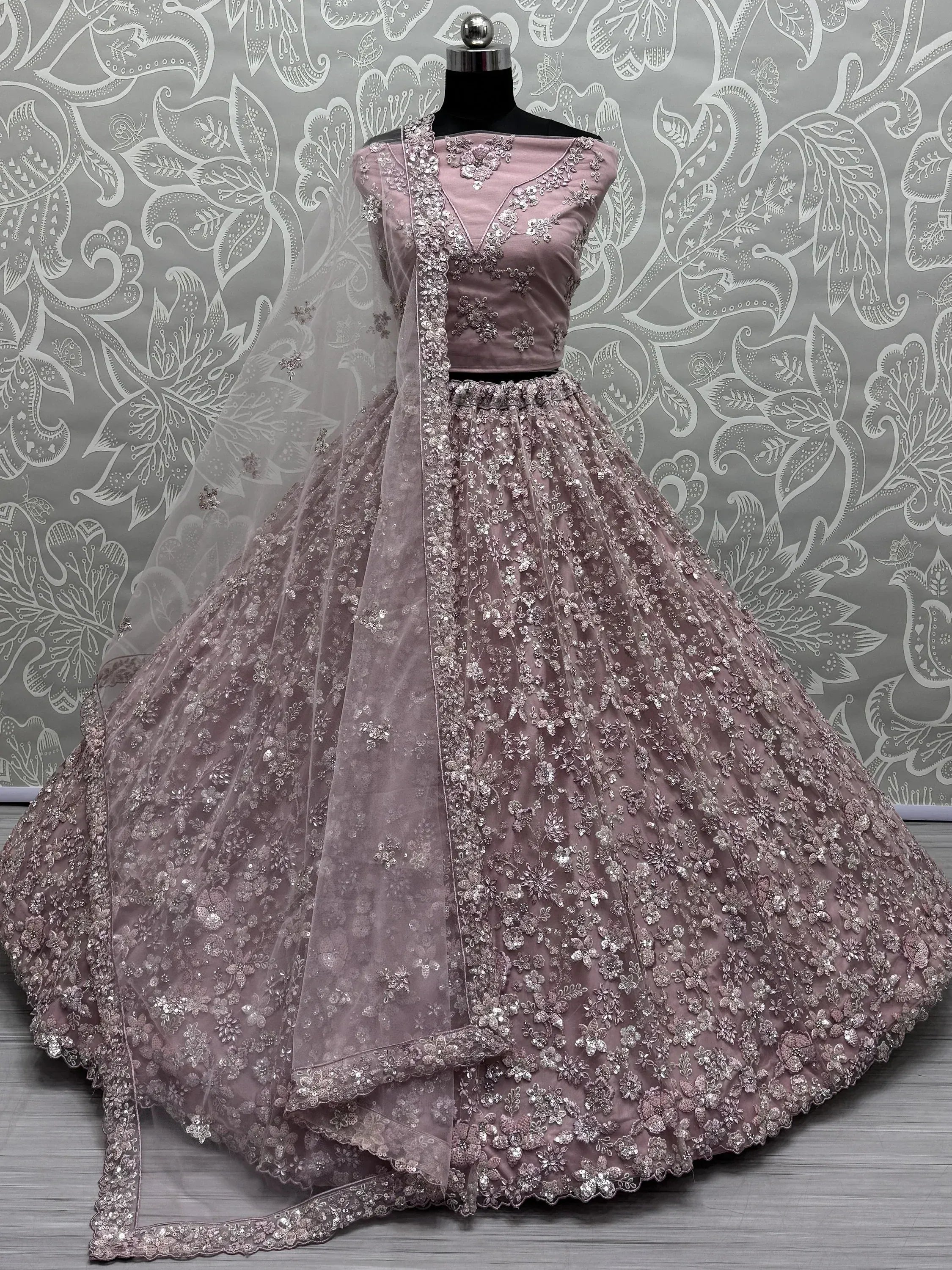 Dusty pink designer lehenga choli with floral embroidery and sequin work, perfect for weddings and parties