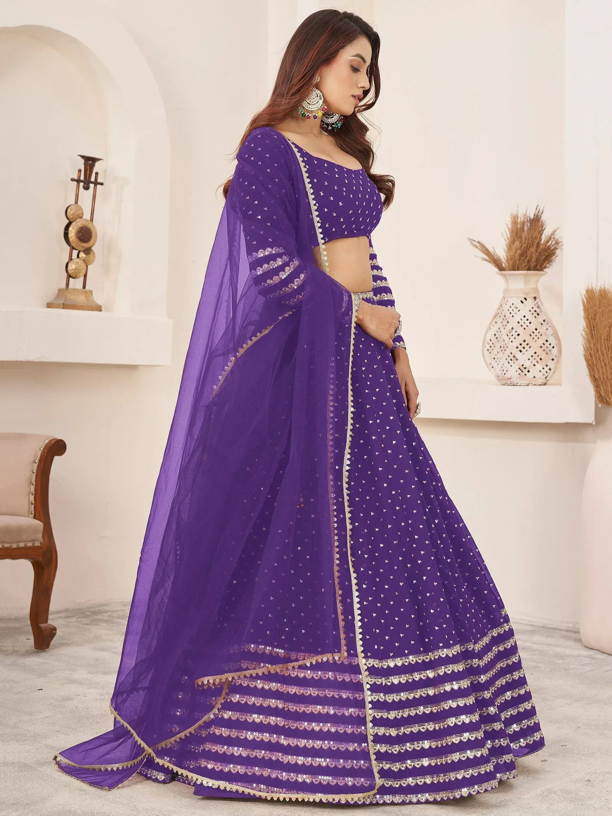 Purple designer lehenga choli with gold embroidery and sheer dupatta for Indian ethnic wear