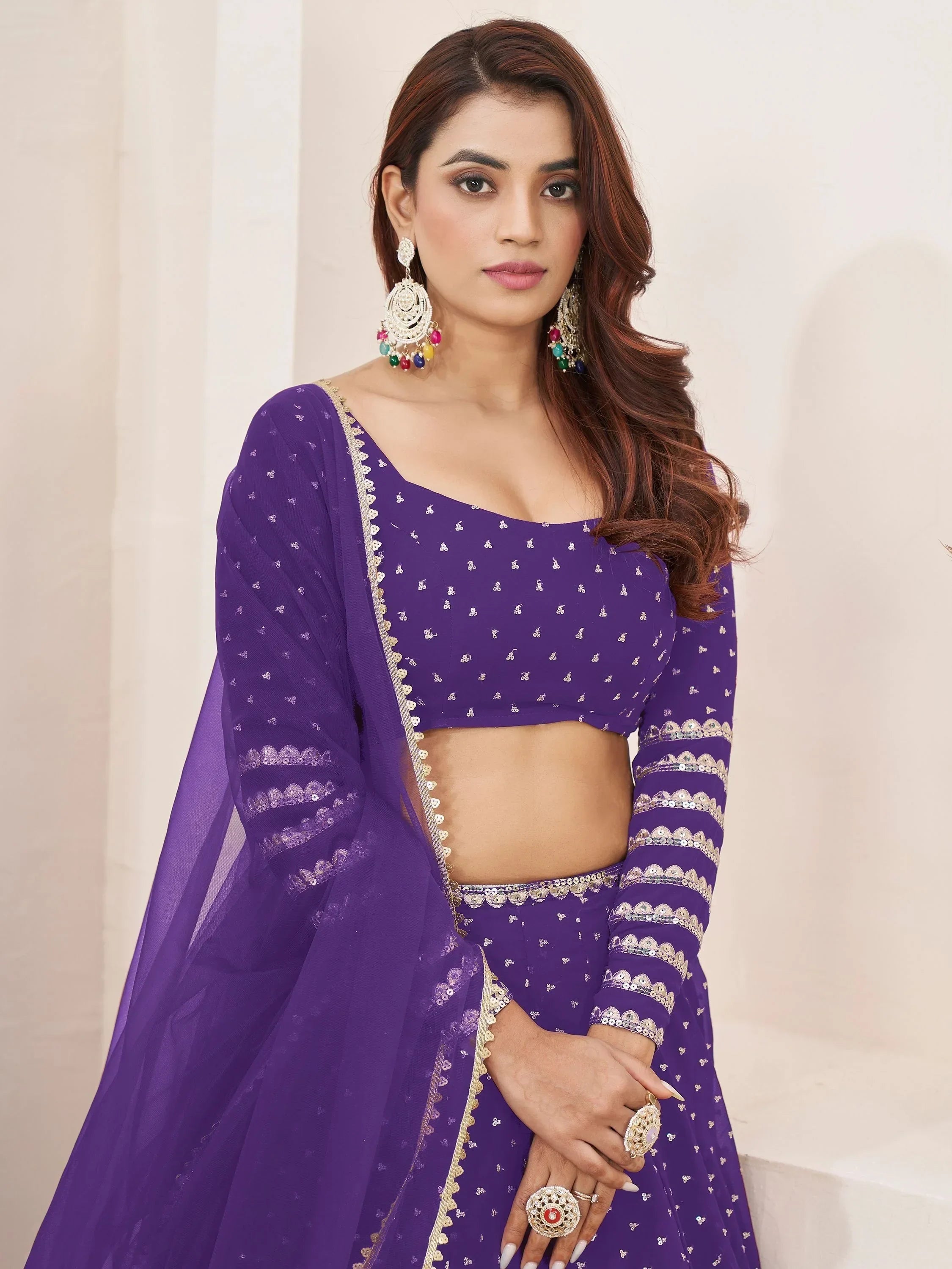 Purple embroidered lehenga choli with gold detailing, perfect for Indian ethnic wear events