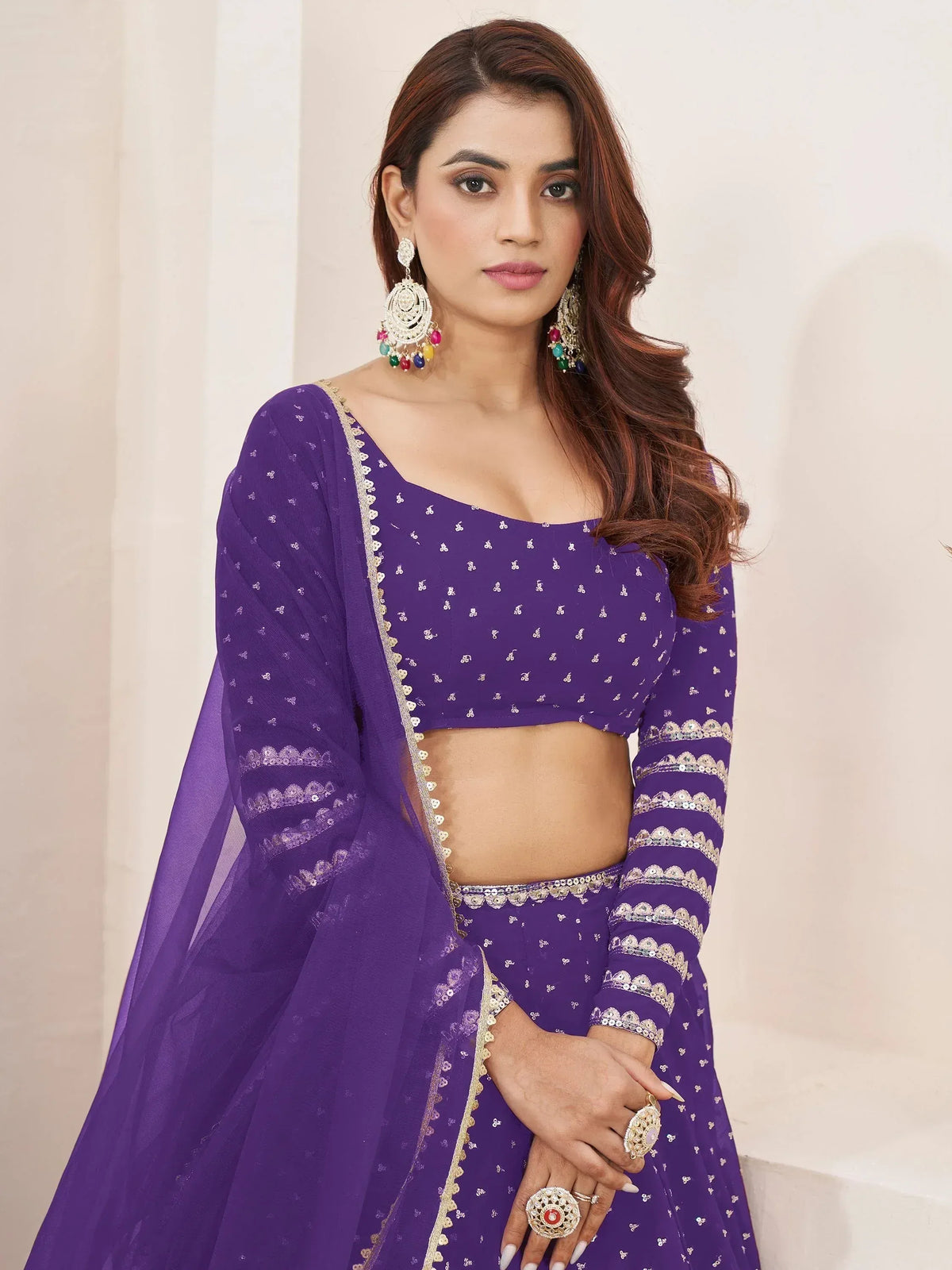 Purple embroidered lehenga choli with gold detailing, perfect for Indian ethnic wear events