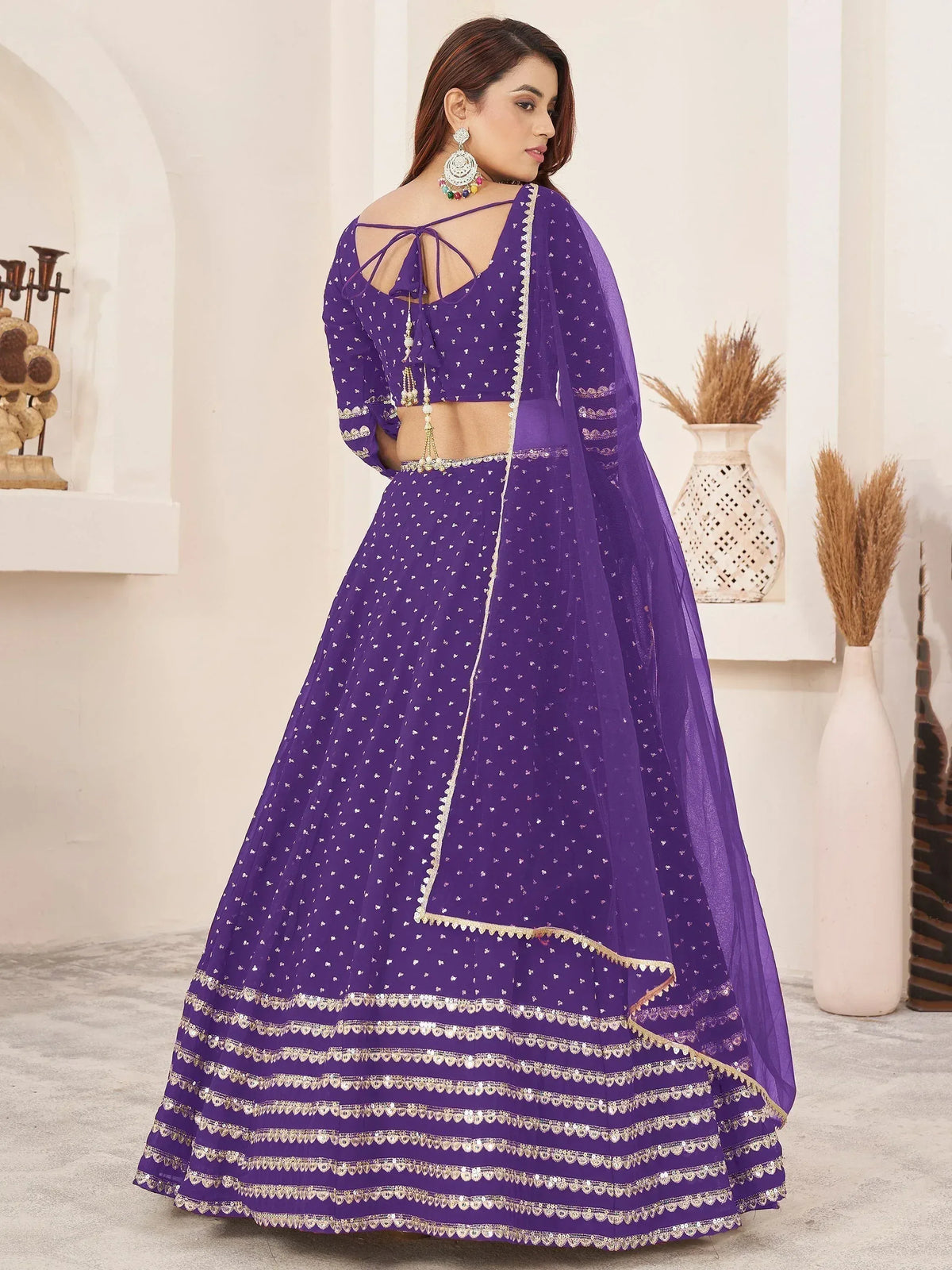 Purple designer lehenga choli with gold embroidery and back tie blouse, perfect for Indian ethnic occasions