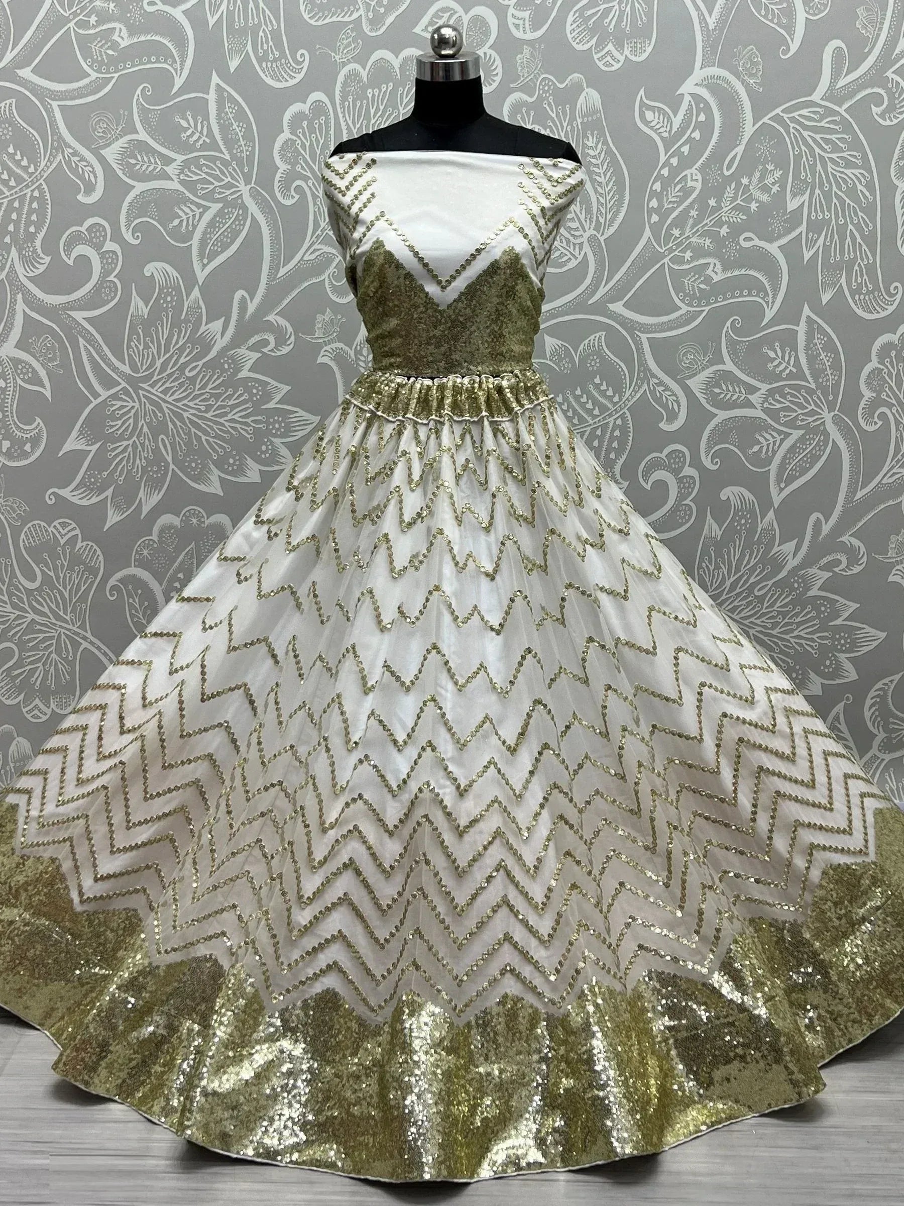 White and gold sequin ethnic gown with zigzag pattern, off-shoulder design, perfect for Indian occasions