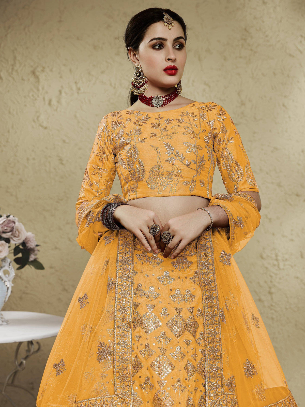 Yellow embroidered lehenga choli with peacock motifs, perfect for Indian ethnic wear and festive occasions.