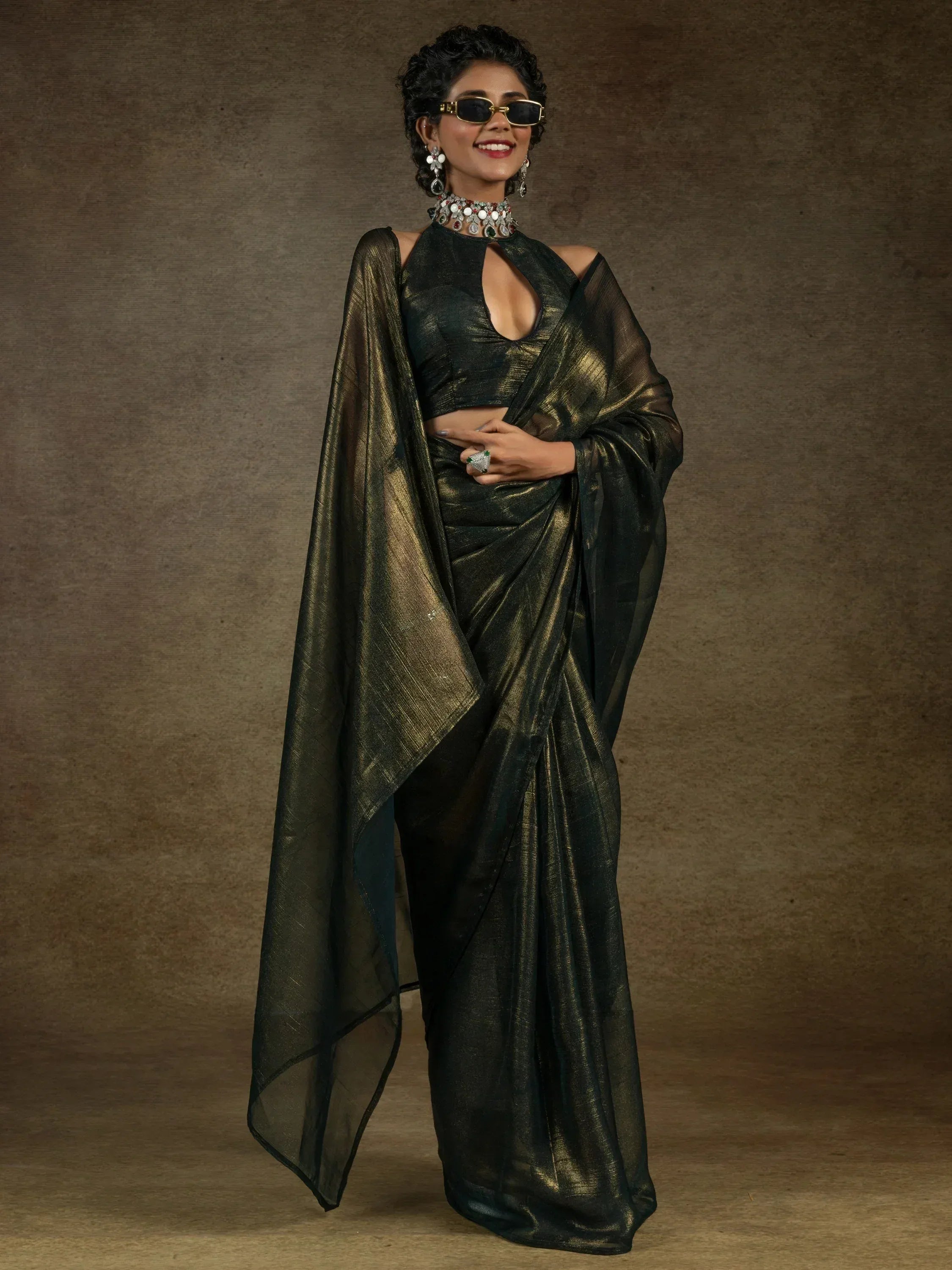 Stylish black and gold saree with modern blouse, perfect for ethnic occasions and festive events.