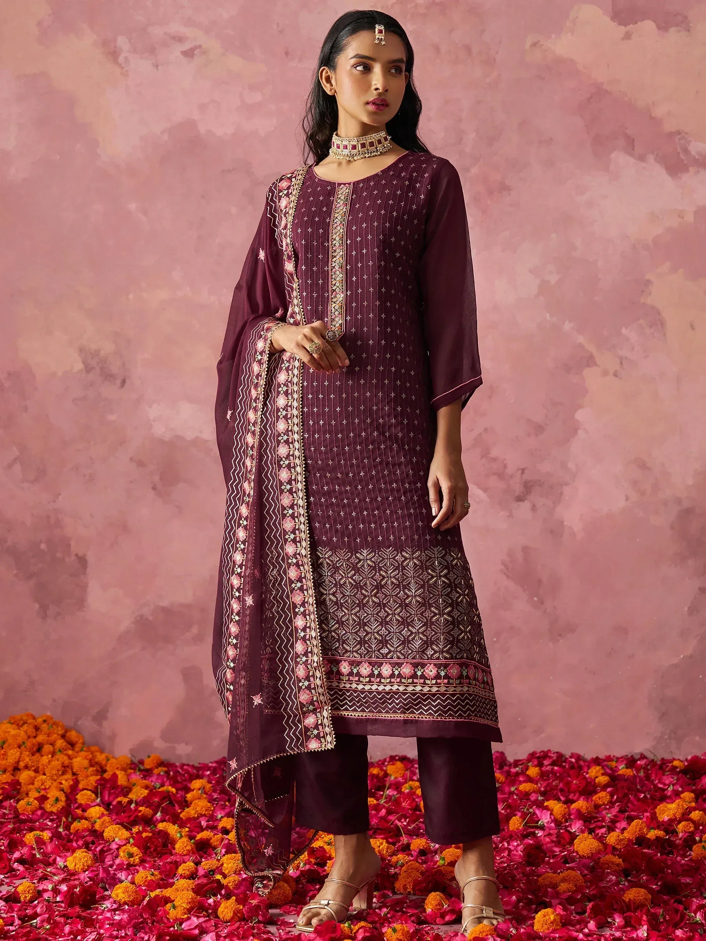 Elegant maroon embroidered salwar kameez with floral dupatta, perfect for Indian ethnic occasions