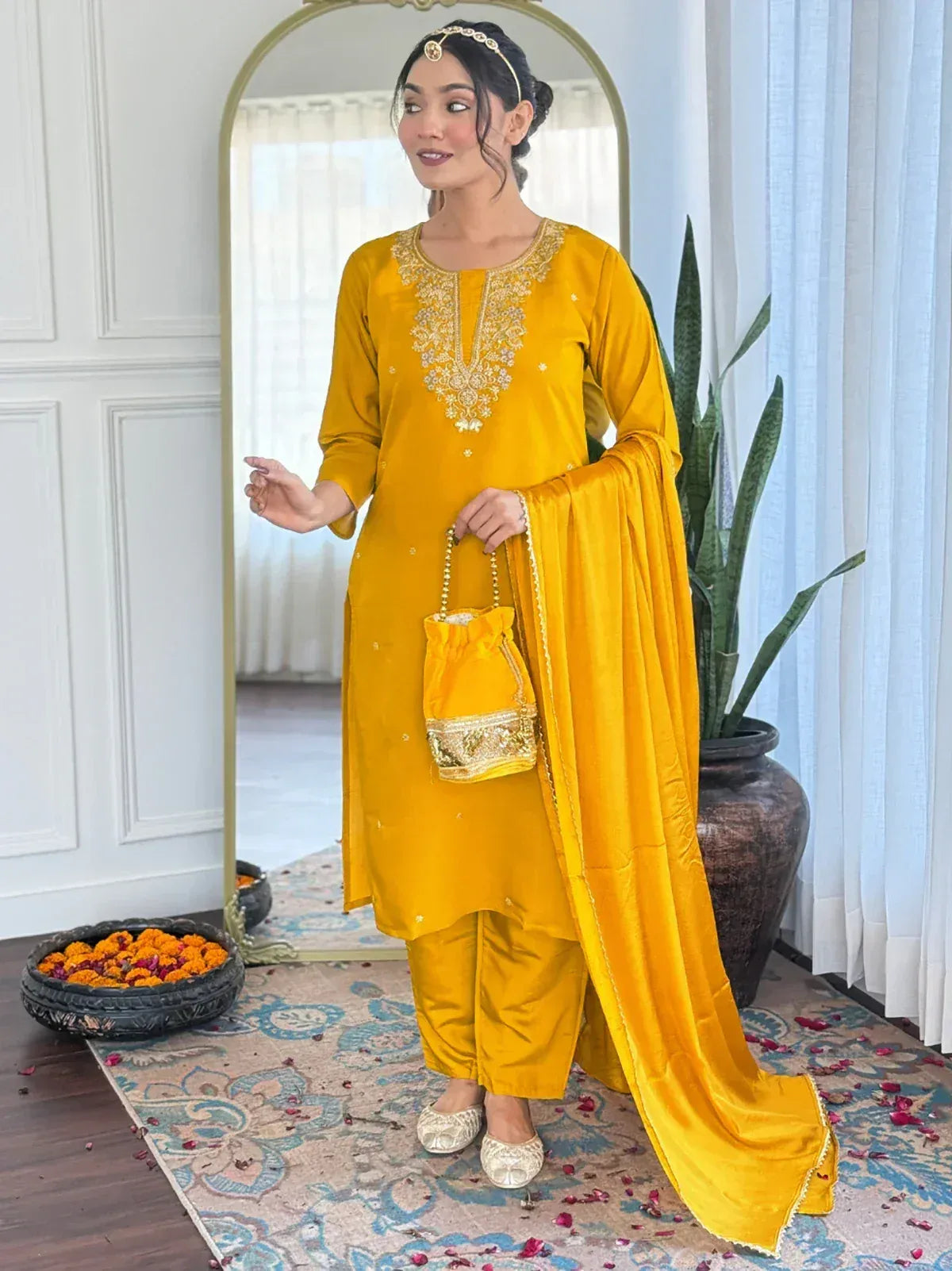 Yellow ethnic salwar kameez with gold embroidery and matching dupatta, perfect for festive occasions.