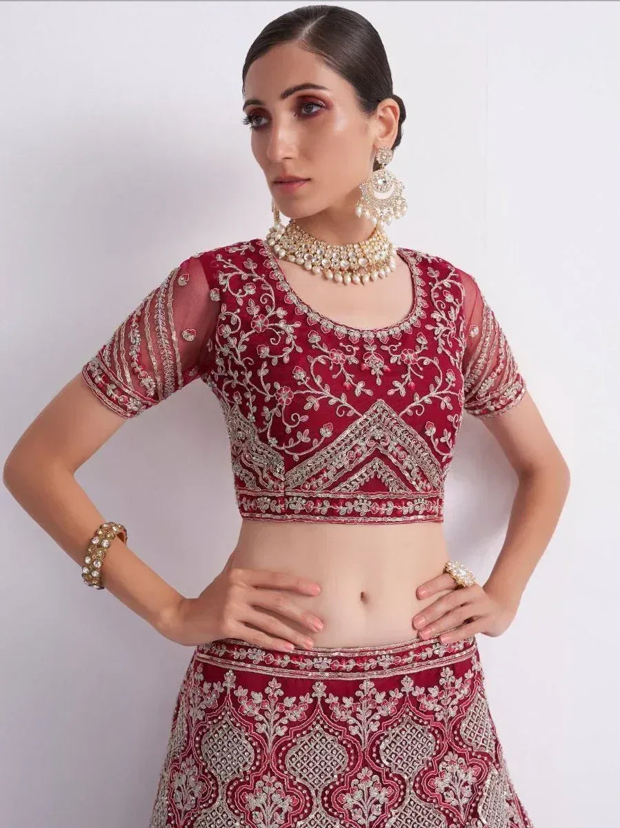 Maroon embroidered lehenga choli with gold detailing, perfect for Indian ethnic wear and festive occasions.
