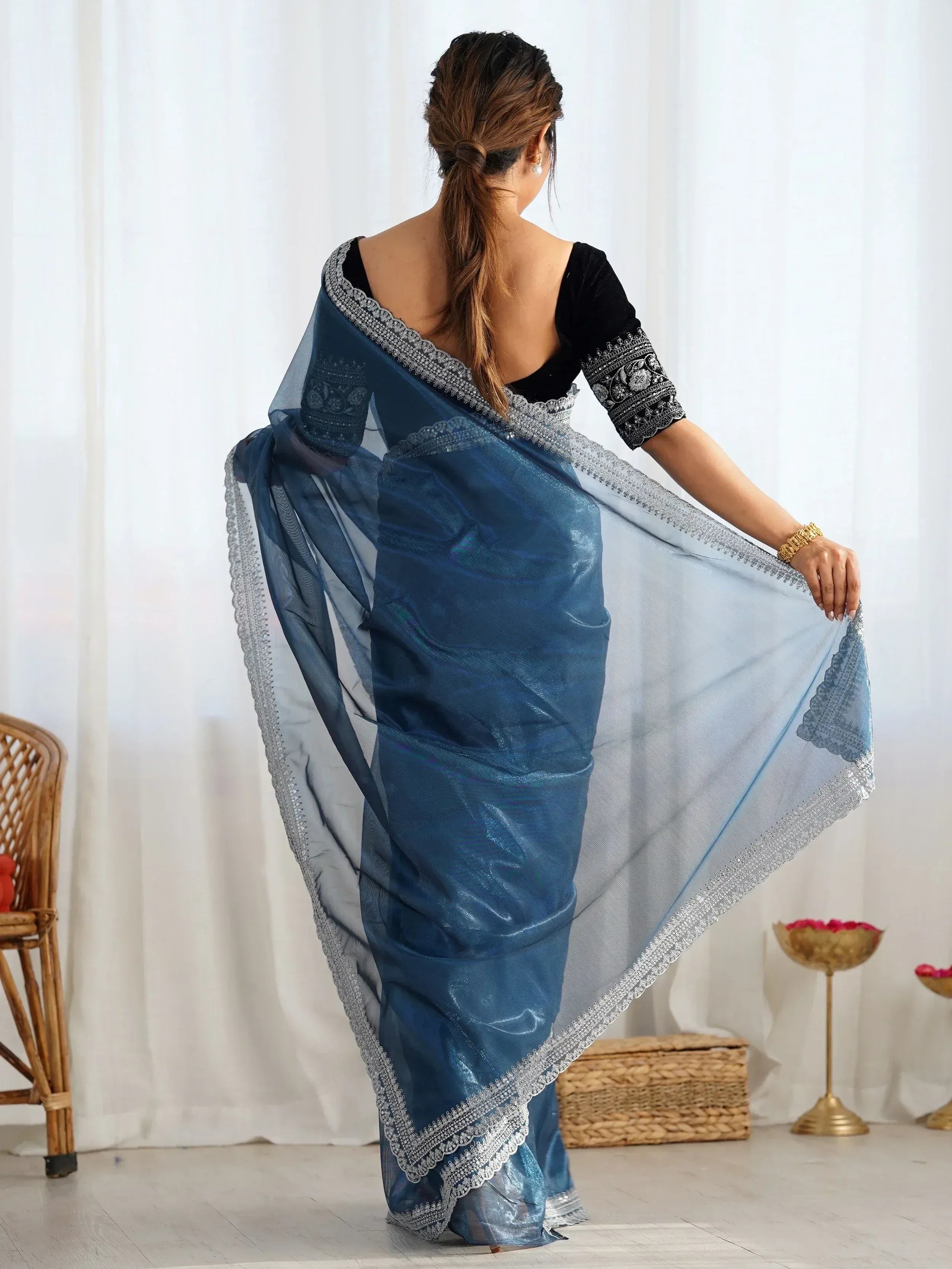 Blue shimmer saree with silver embroidery, paired with black velvet blouse, perfect for Indian ethnic wear