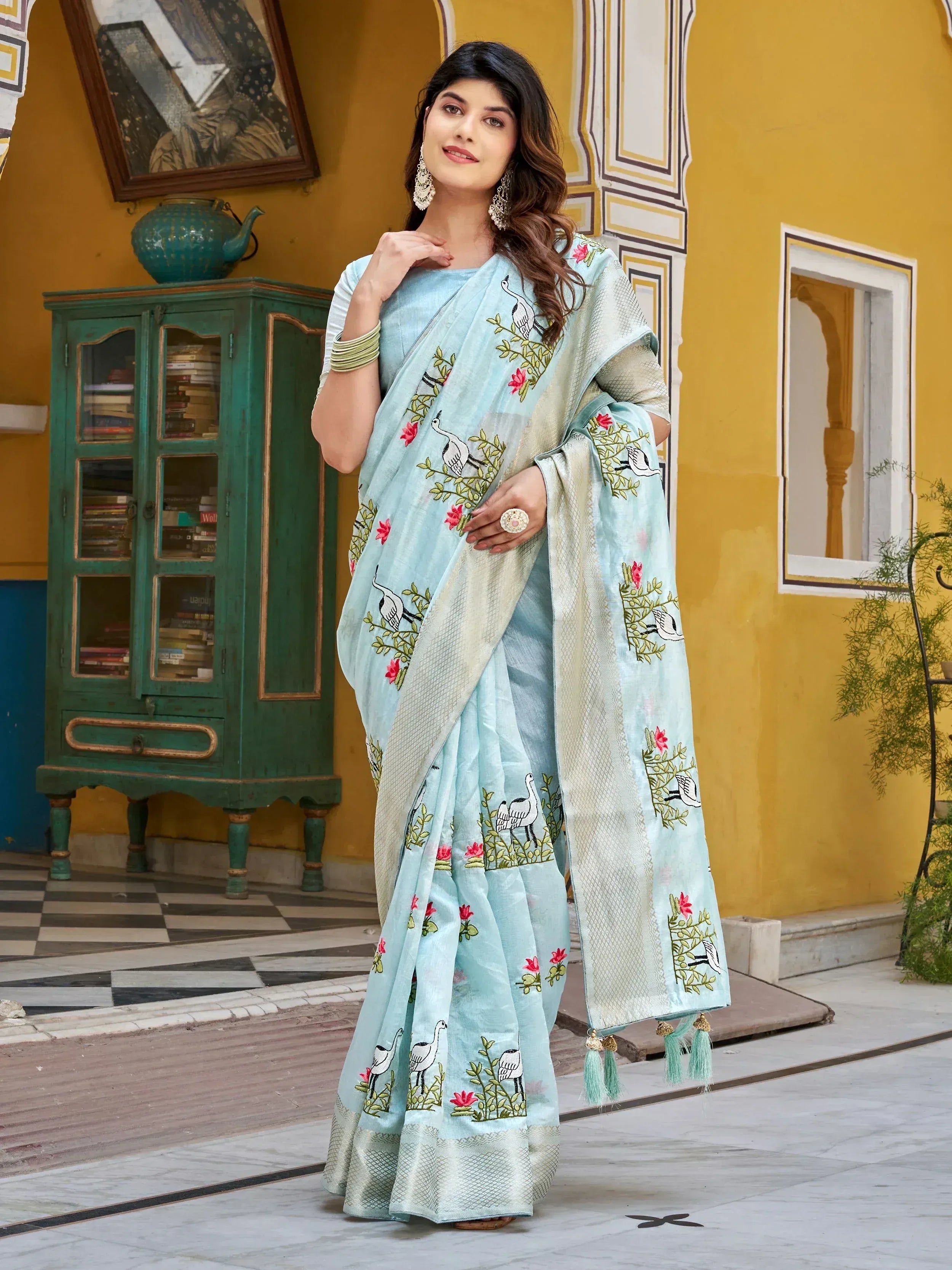 Light blue embroidered saree with bird and floral motifs, perfect for Indian ethnic wear occasions