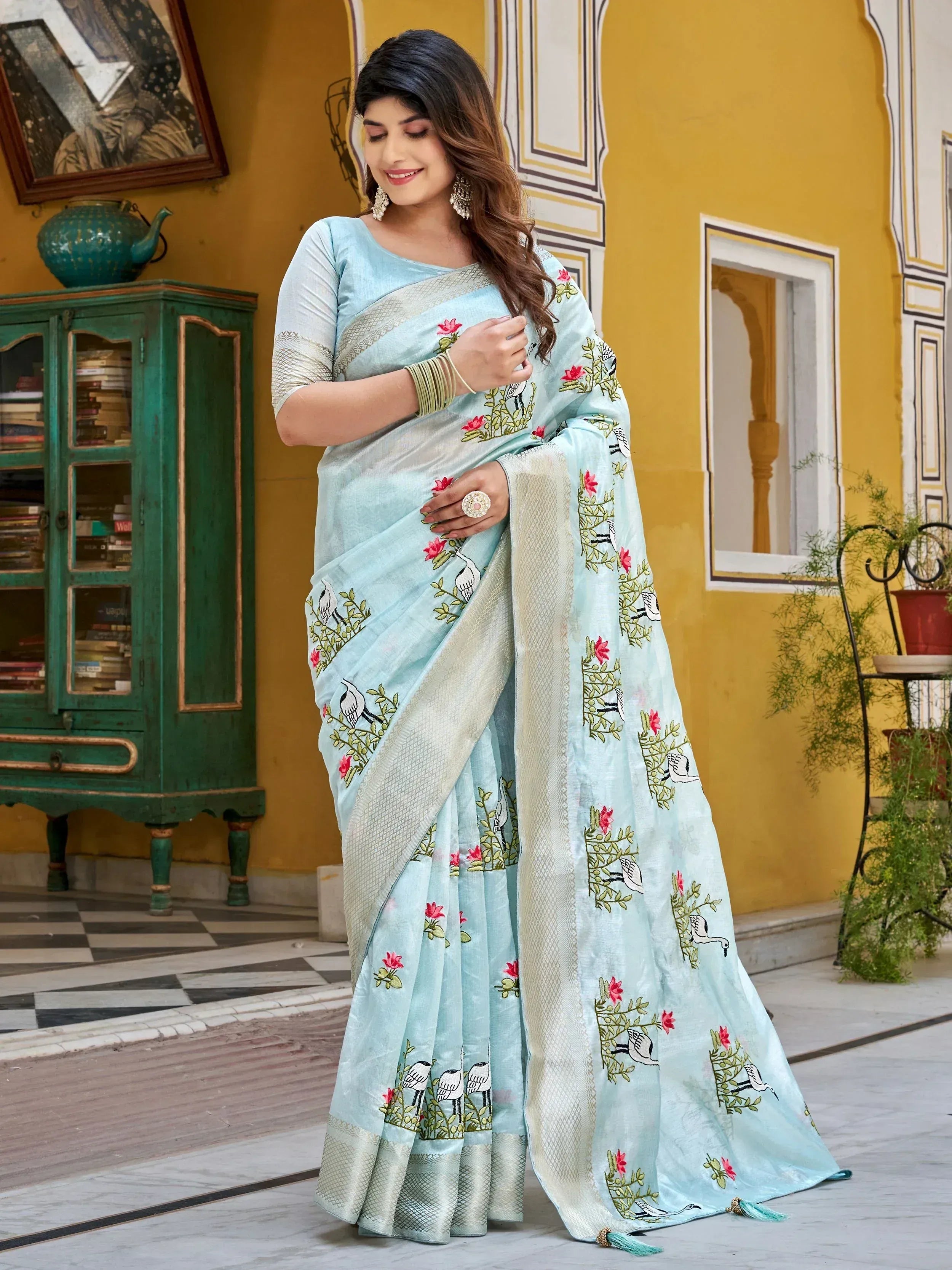Light blue embroidered saree with bird and floral motifs, perfect for Indian ethnic wear occasions