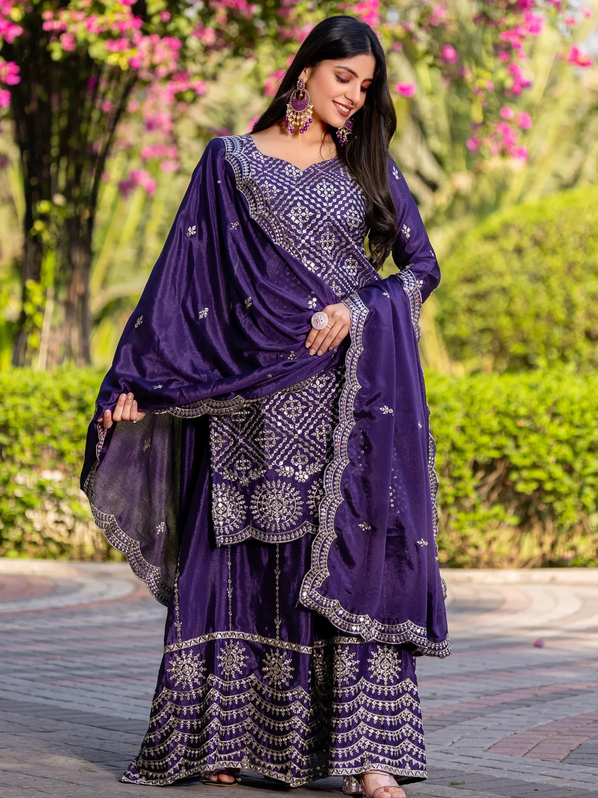 Purple embroidered Indian salwar kameez with mirror work, perfect for festive occasions and weddings