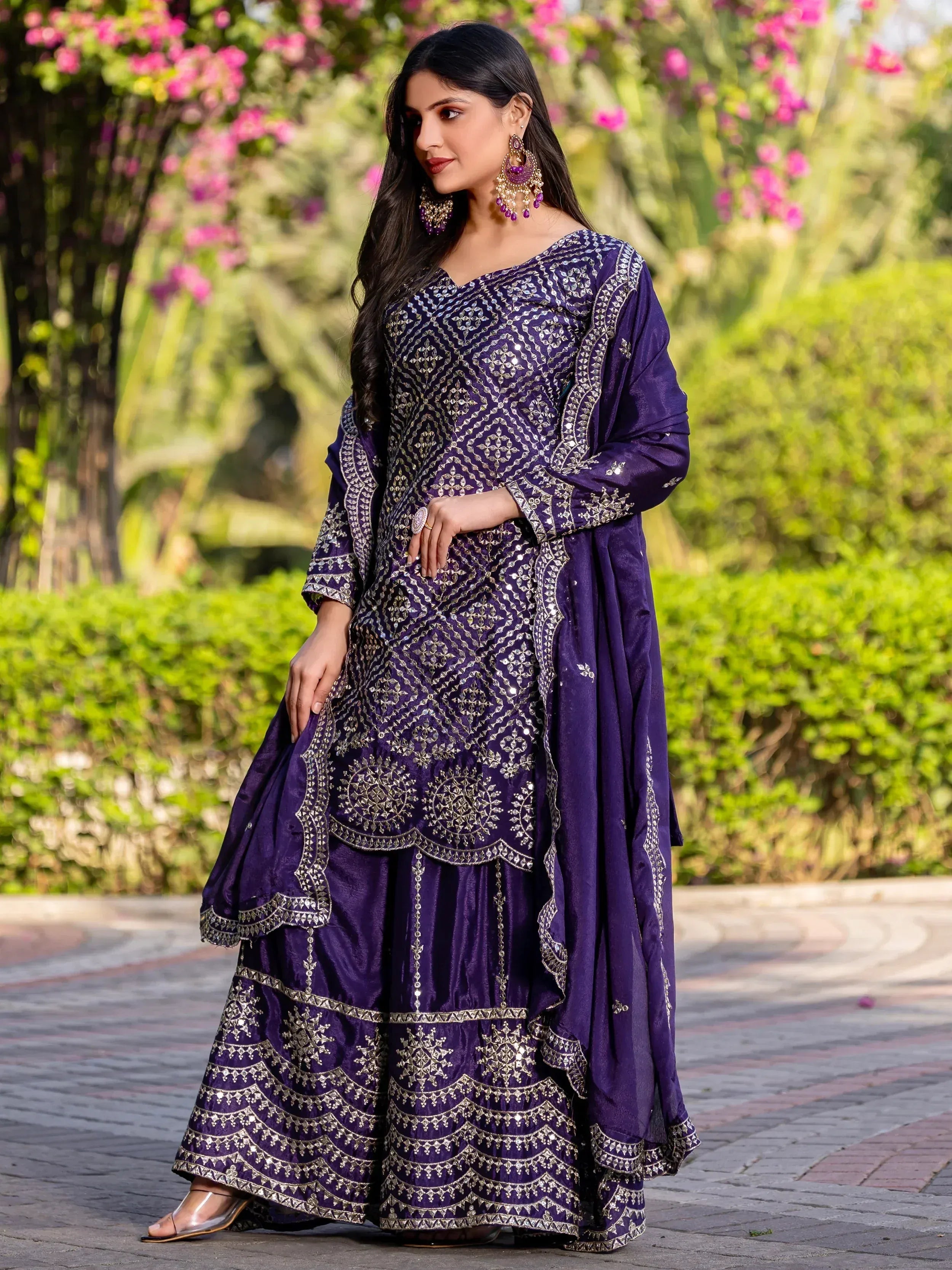 Purple embroidered Indian ethnic gown with mirror work, perfect for festive occasions and weddings.
