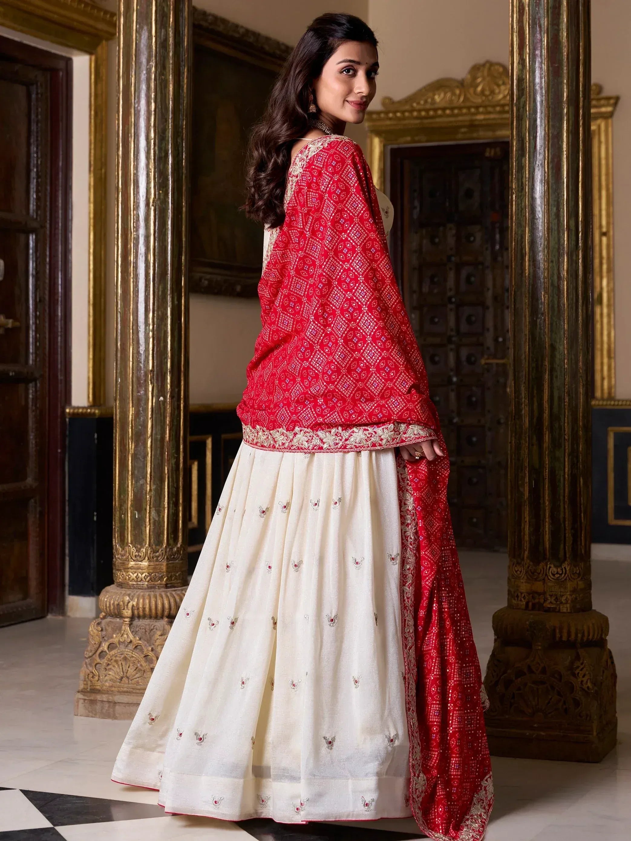 Red and cream embroidered lehenga choli with mirror work, perfect for Indian ethnic wear occasions