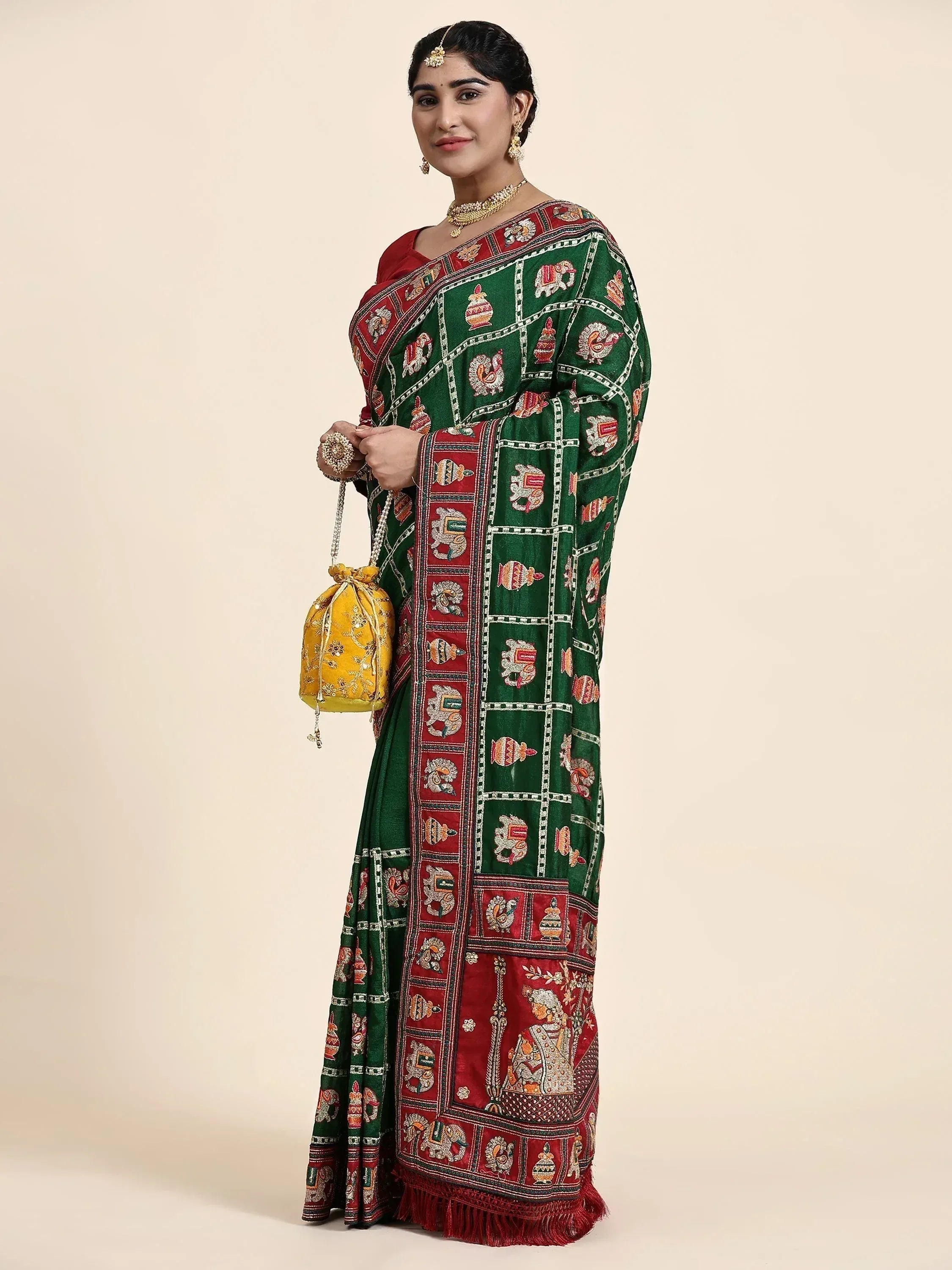 Green and red embroidered saree with elephant motifs, traditional Indian ethnic wear for women