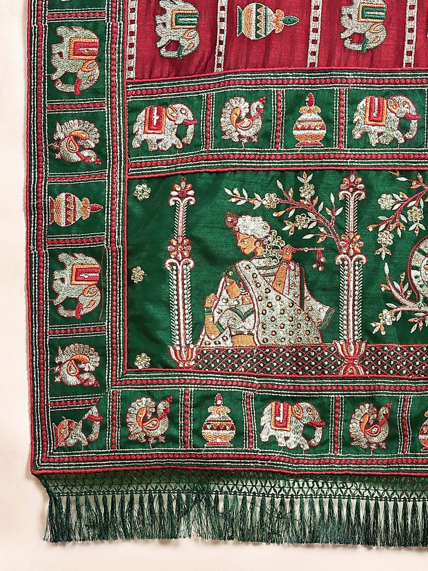 Green and red embroidered Indian textile with elephants, peacocks, and royal figure, perfect for ethnic wear.
