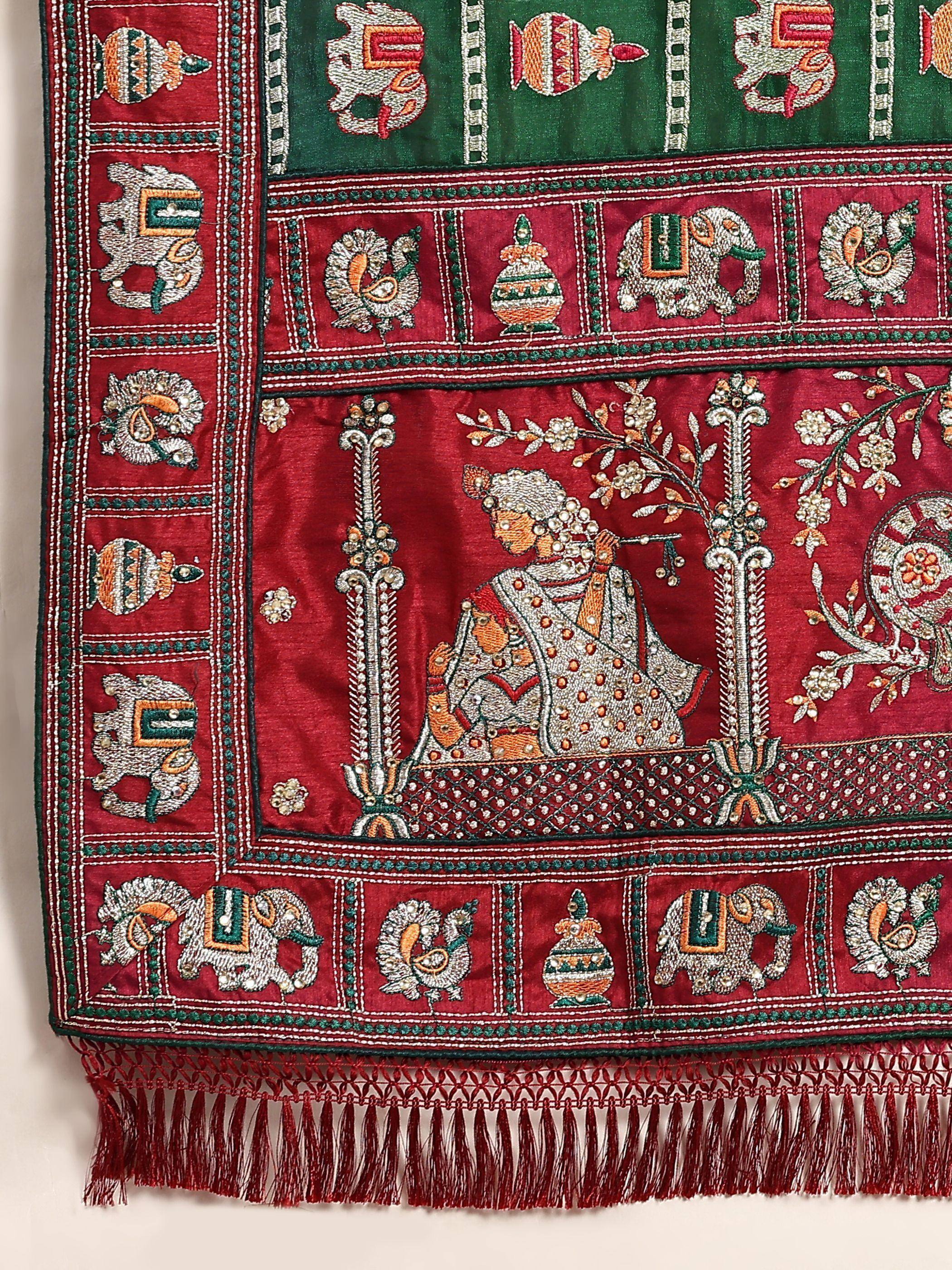 Richly embroidered Indian ethnic fabric with peacock, elephant motifs, beadwork, and tassels for saree or lehenga