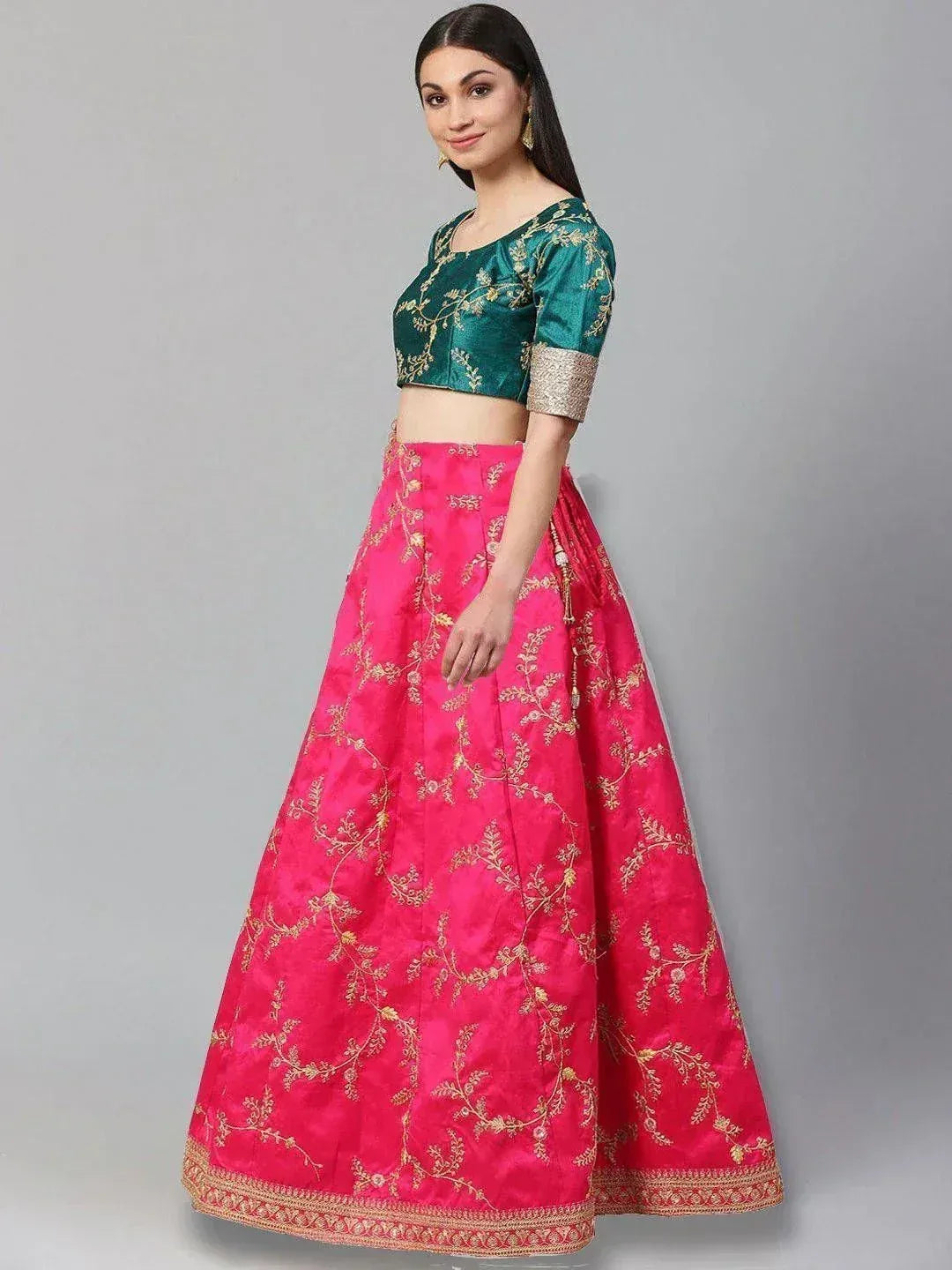 Pink and green embroidered lehenga choli with gold floral work, perfect for Indian ethnic wear occasions