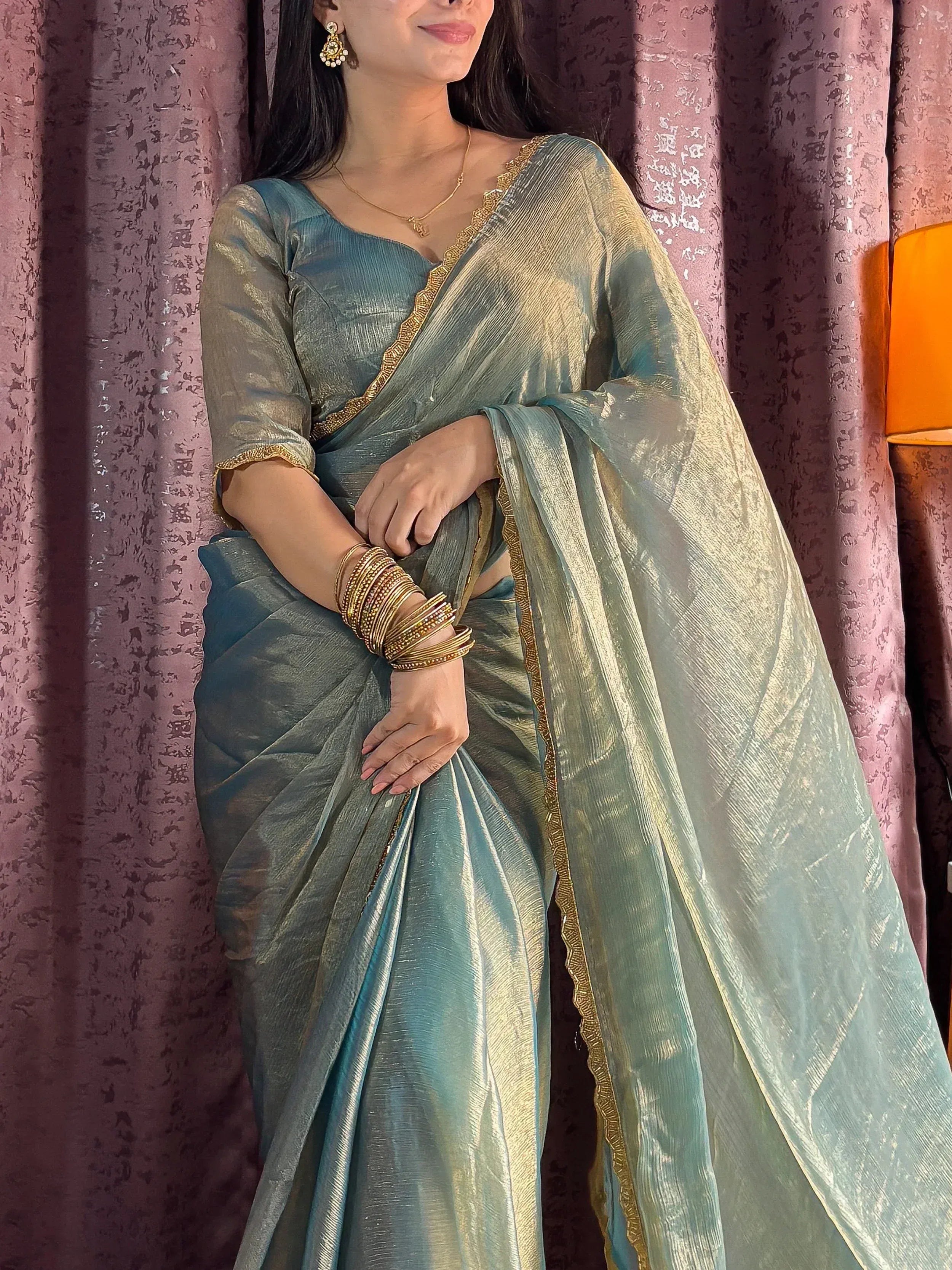 Elegant teal saree with gold border, perfect for Indian ethnic wear occasions