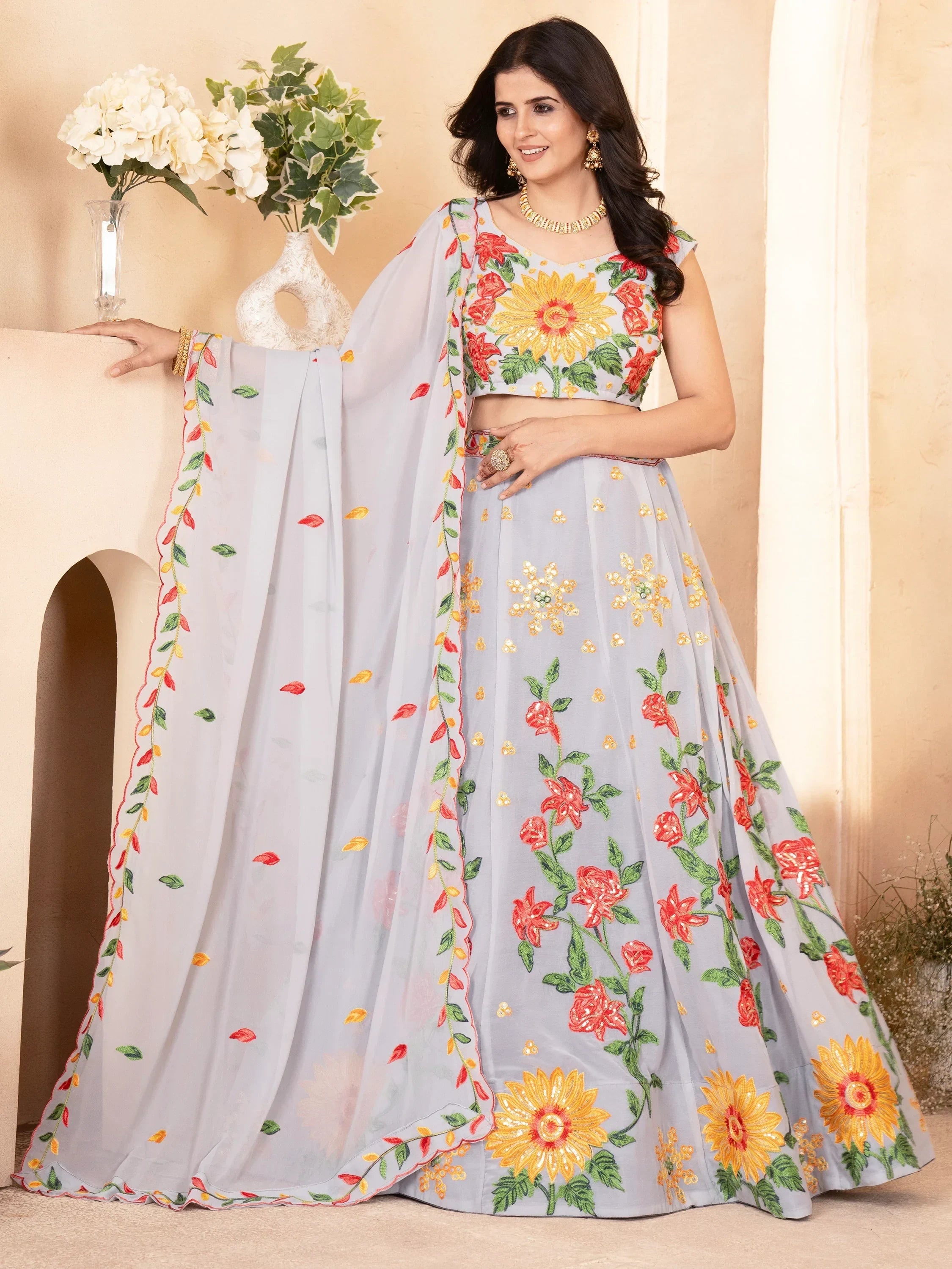 Grey floral embroidered lehenga choli with sunflower design, perfect for Indian ethnic occasions