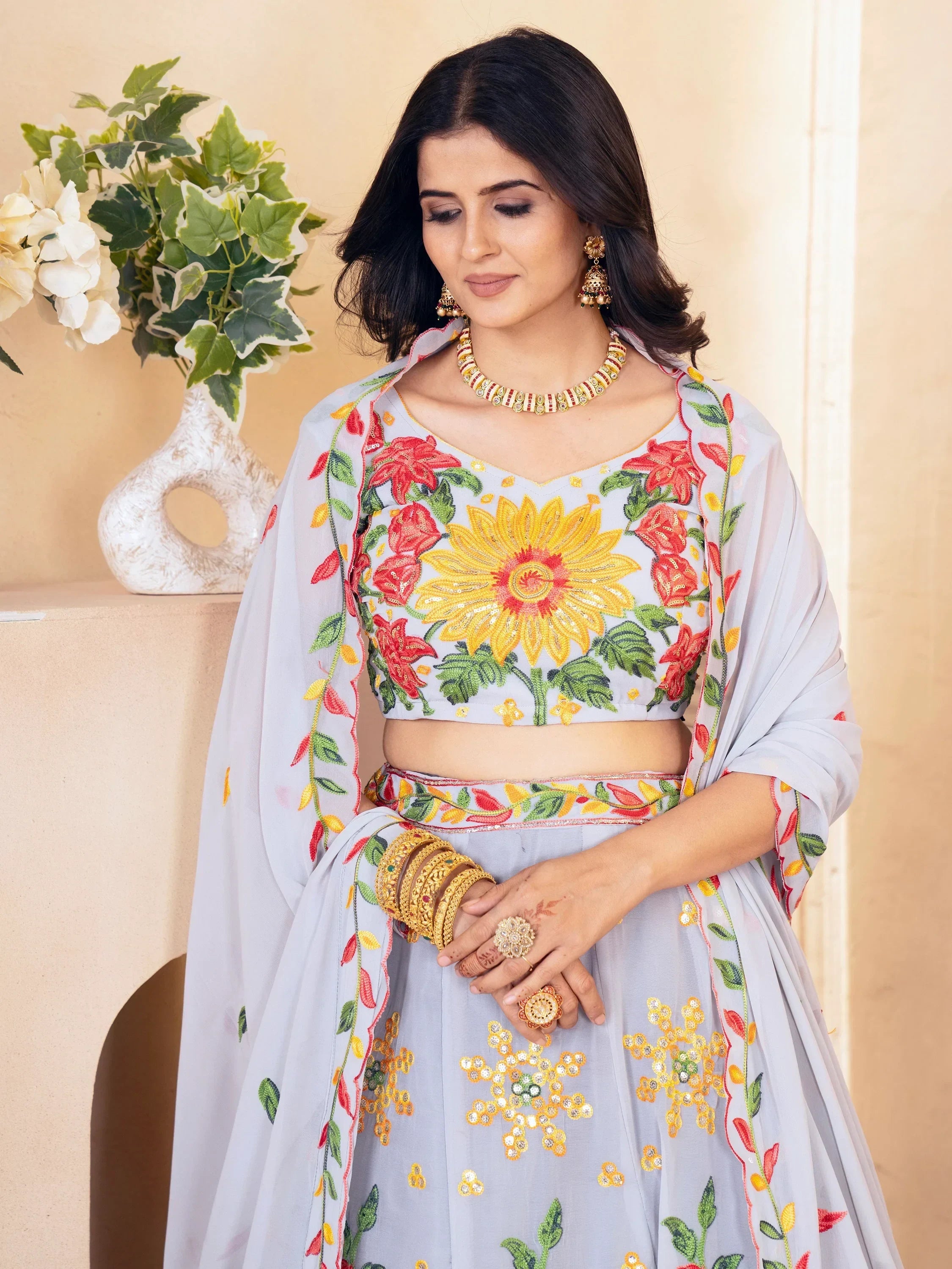 Grey floral embroidered lehenga choli with sunflower design, perfect for Indian ethnic wear occasions