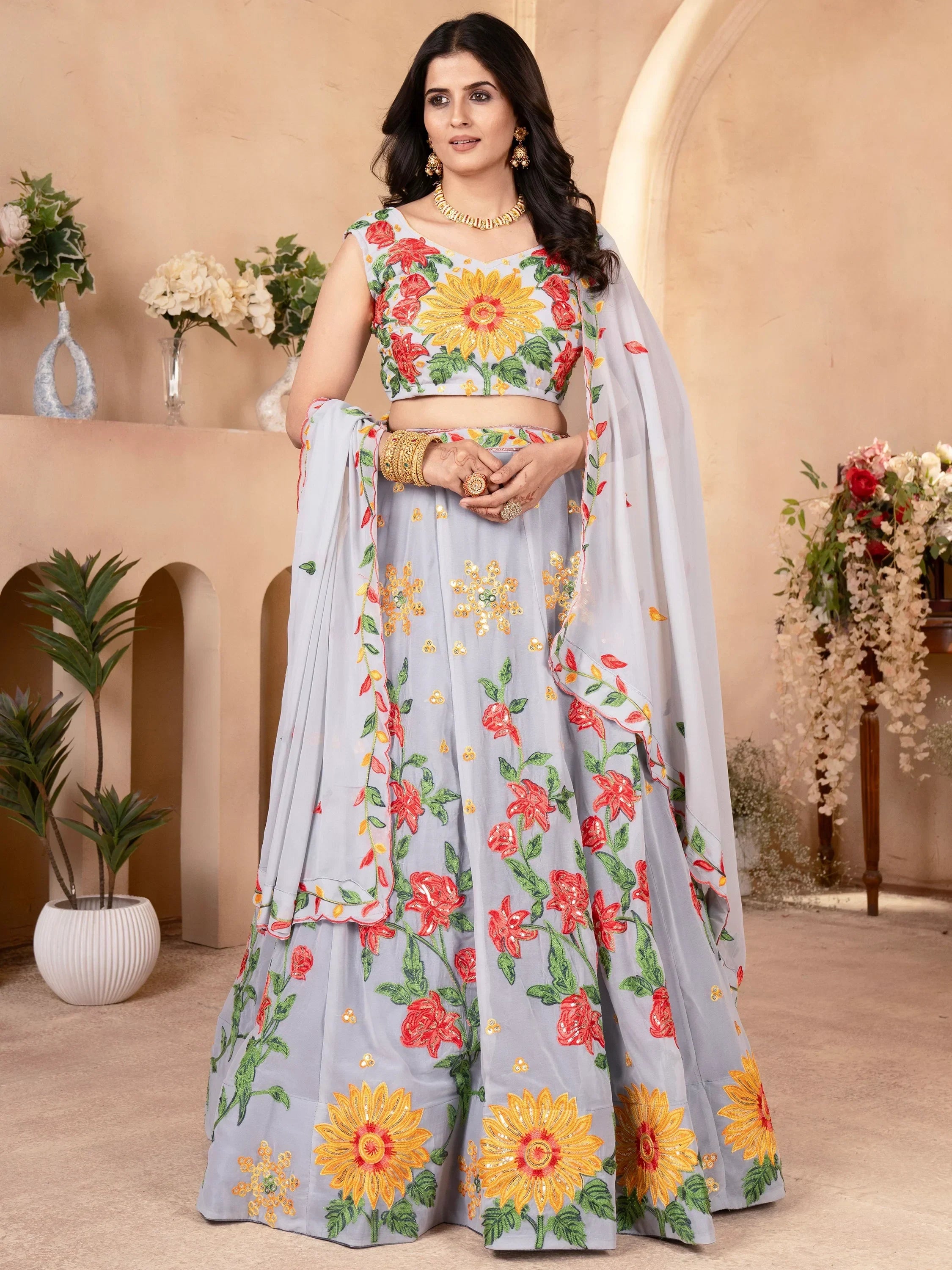 Grey floral embroidered lehenga choli with sunflower design, perfect for Indian ethnic occasions