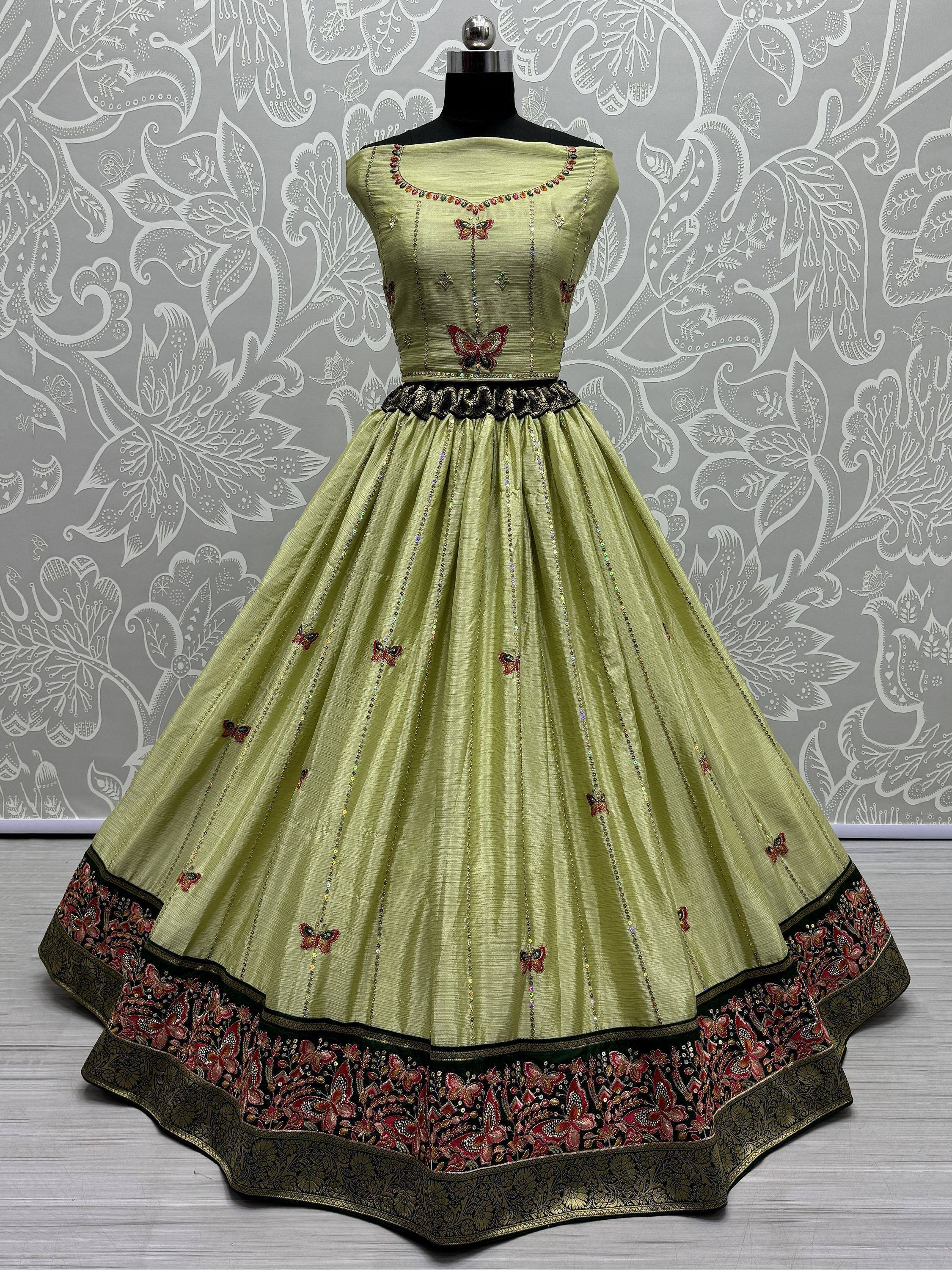 Light green ethnic gown with butterfly embroidery and embellished border, perfect for festive occasions