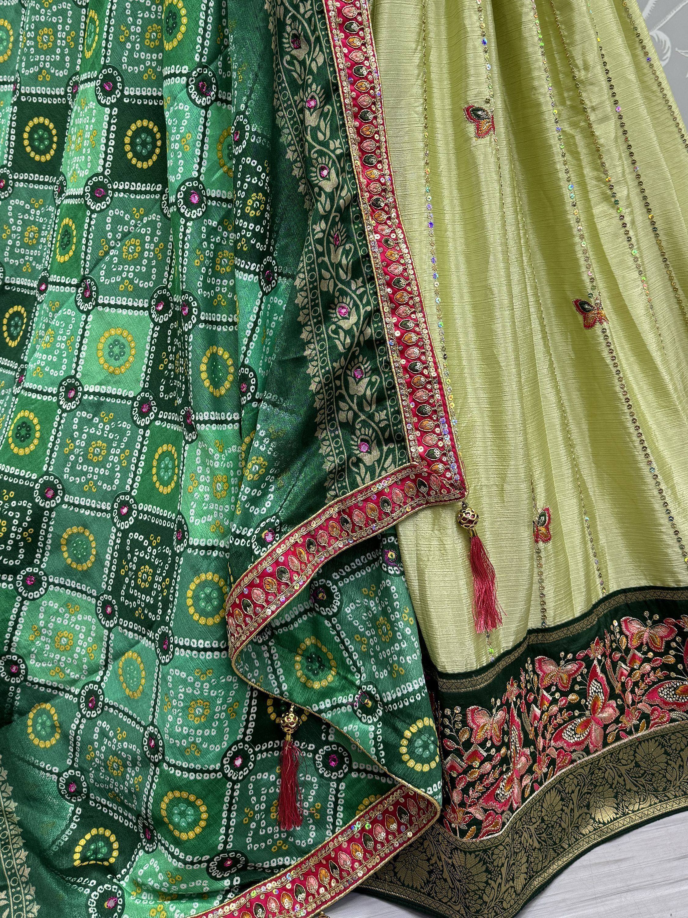 Green and lime Indian ethnic lehenga choli with intricate embroidery, mirror work, and butterfly motifs