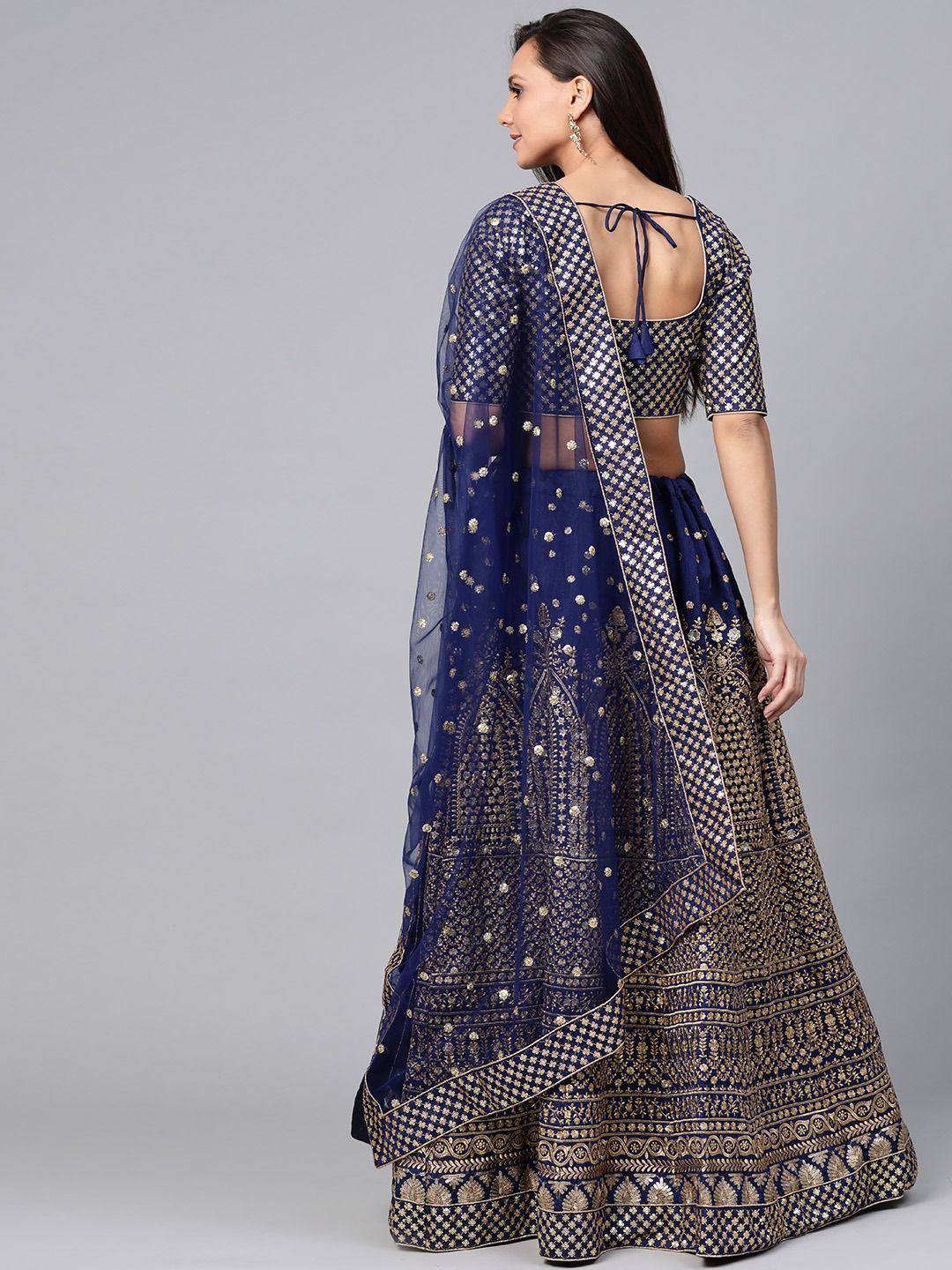 Navy blue designer lehenga choli with gold embroidery and sheer dupatta, ethnic wear for women