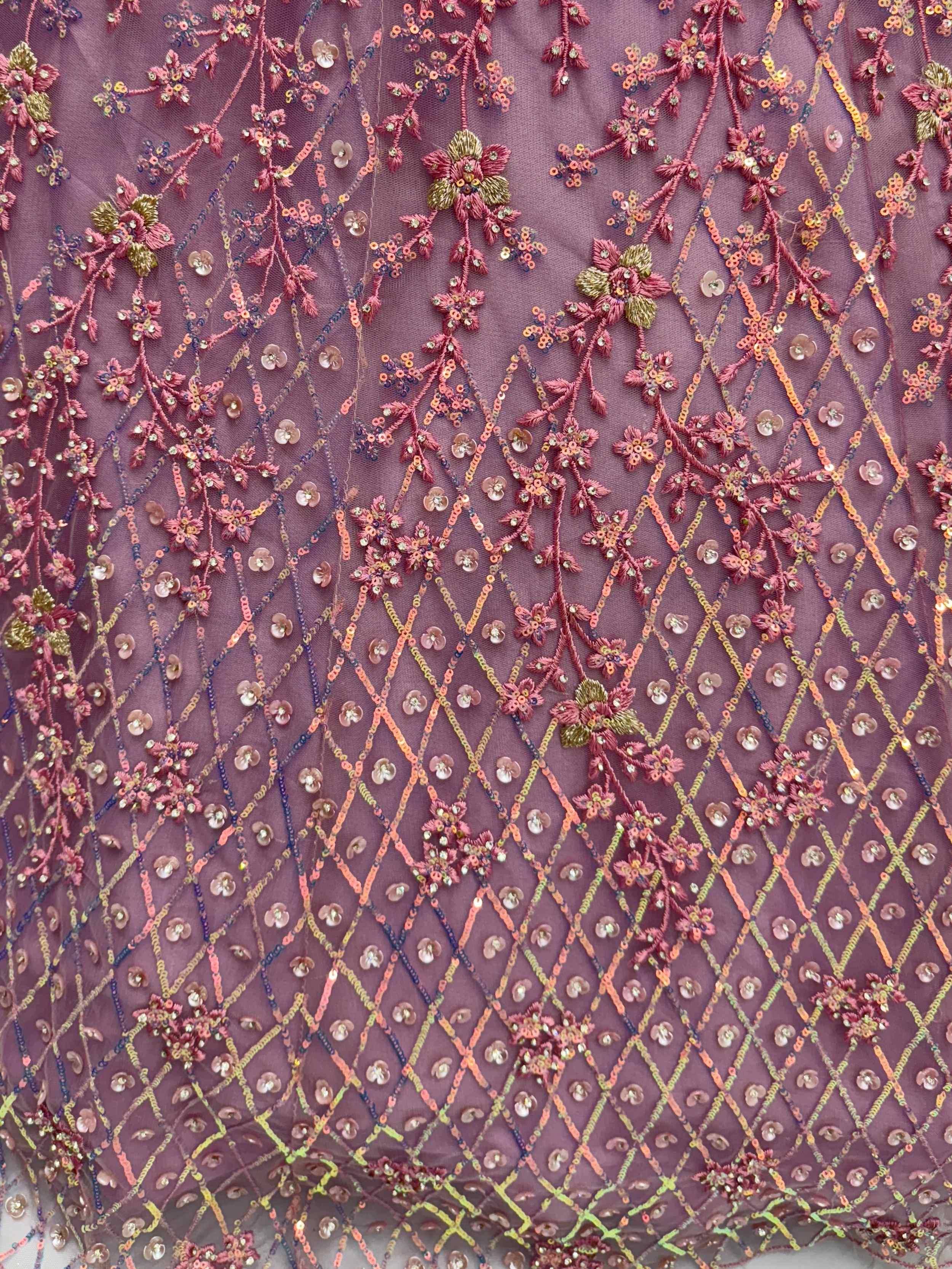 Elegant floral embroidery with sequins on purple fabric, perfect for designer lehenga or saree.