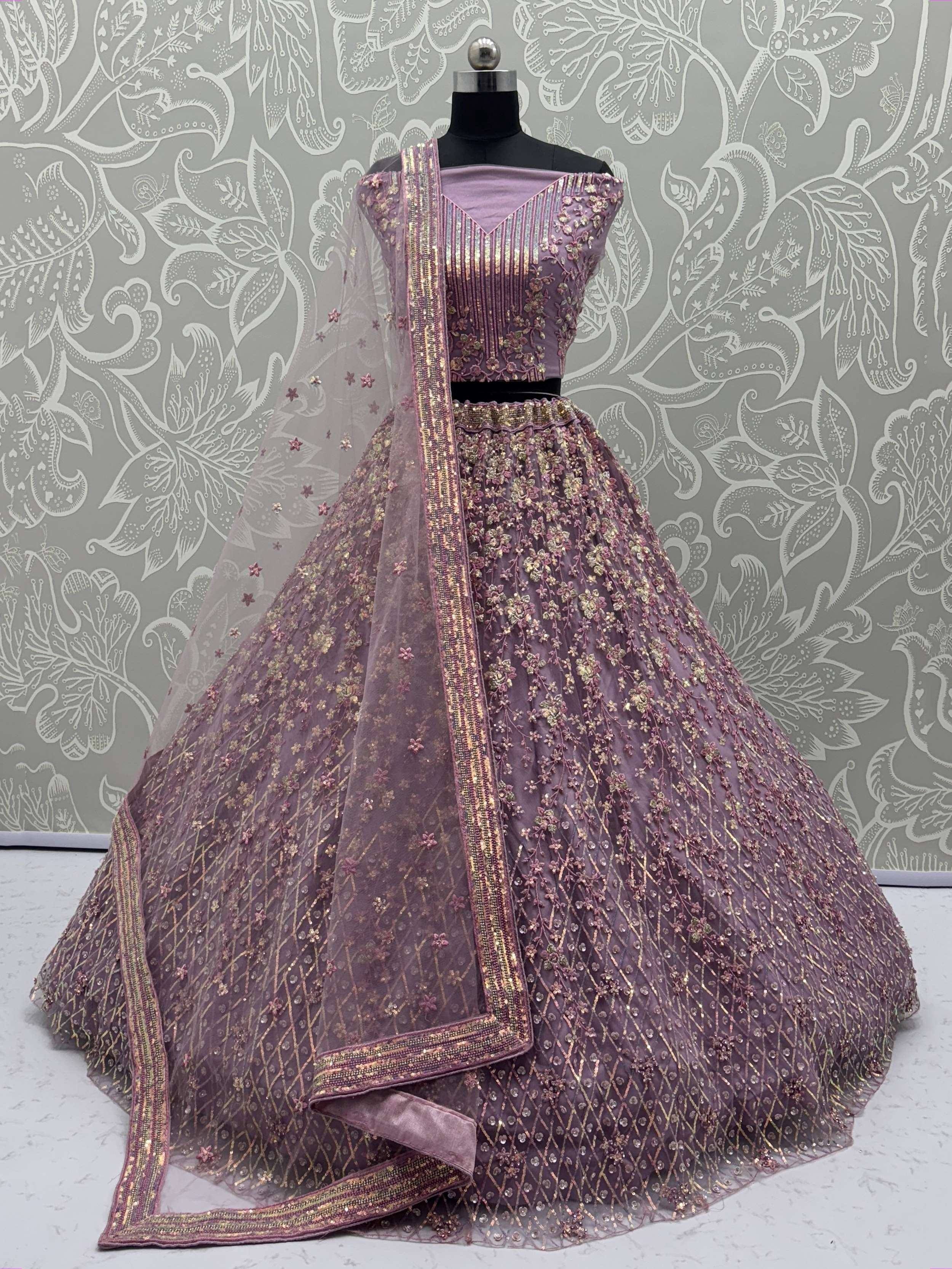 Lavender designer lehenga choli with gold embroidery and net dupatta, perfect for Indian weddings and festive occasions.