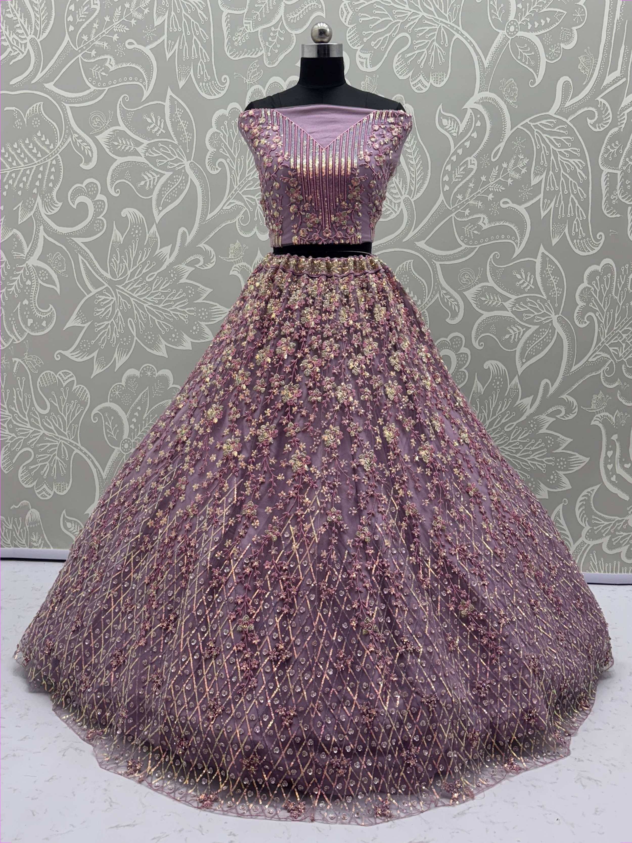 Lavender designer lehenga choli with gold floral embroidery and sequin detailing, perfect for Indian ethnic occasions.