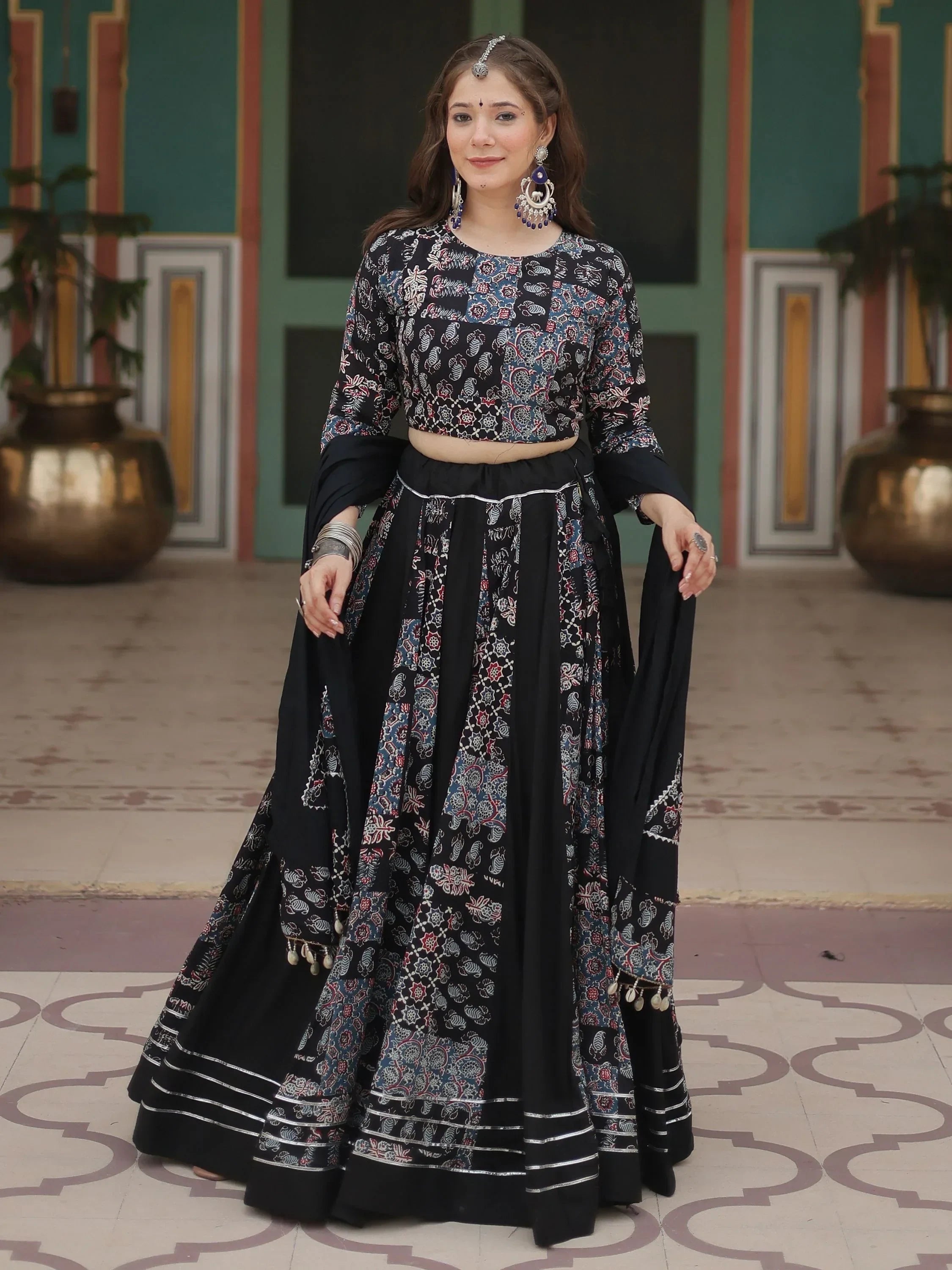 Black printed lehenga choli with silver trim, traditional Indian ethnic wear for women