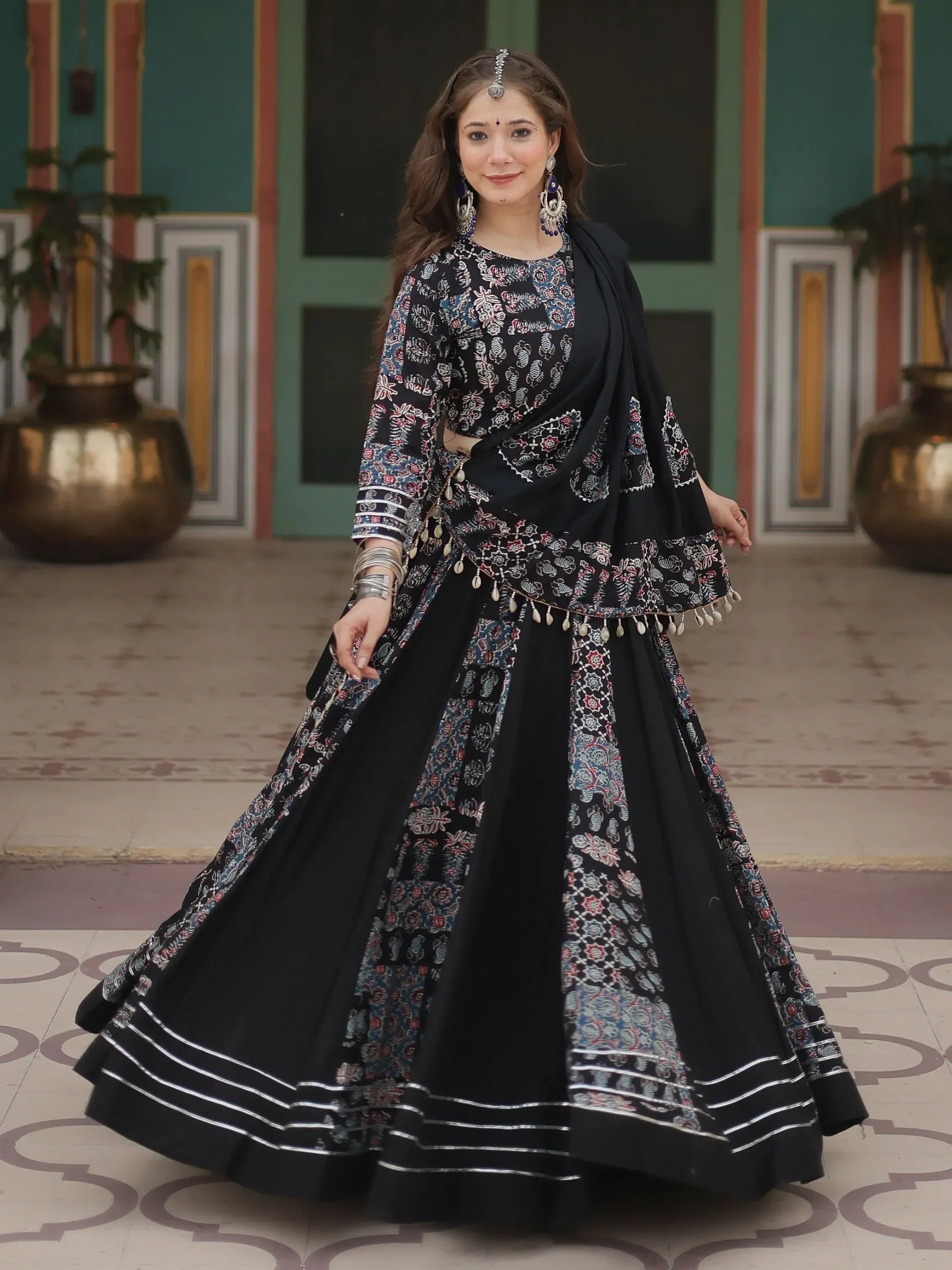 Black printed lehenga choli with silver trim, traditional Indian ethnic wear for women