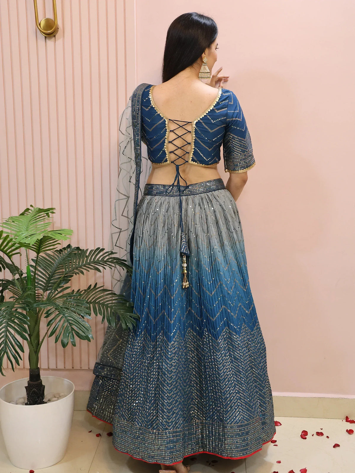 Blue designer lehenga choli with back lace-up blouse, sequin work, and pleated skirt for Indian ethnic wear