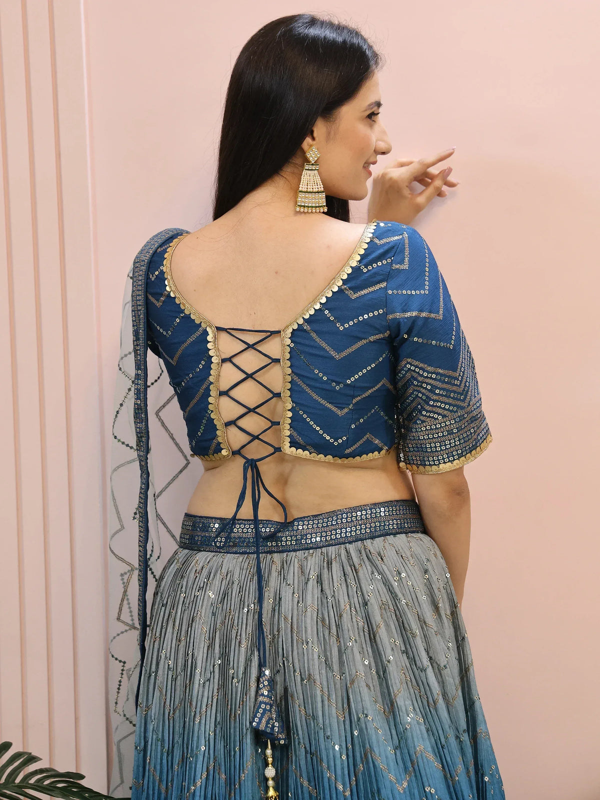 Blue sequin lehenga choli with back lace-up blouse and gold detailing, perfect for Indian ethnic wear