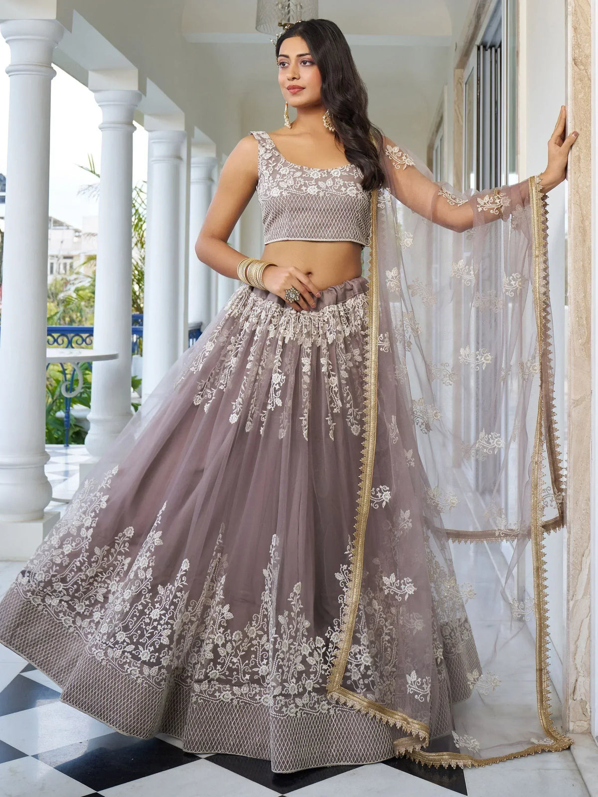 Elegant grey lehenga choli with gold embroidery, perfect for Indian weddings and festive occasions.