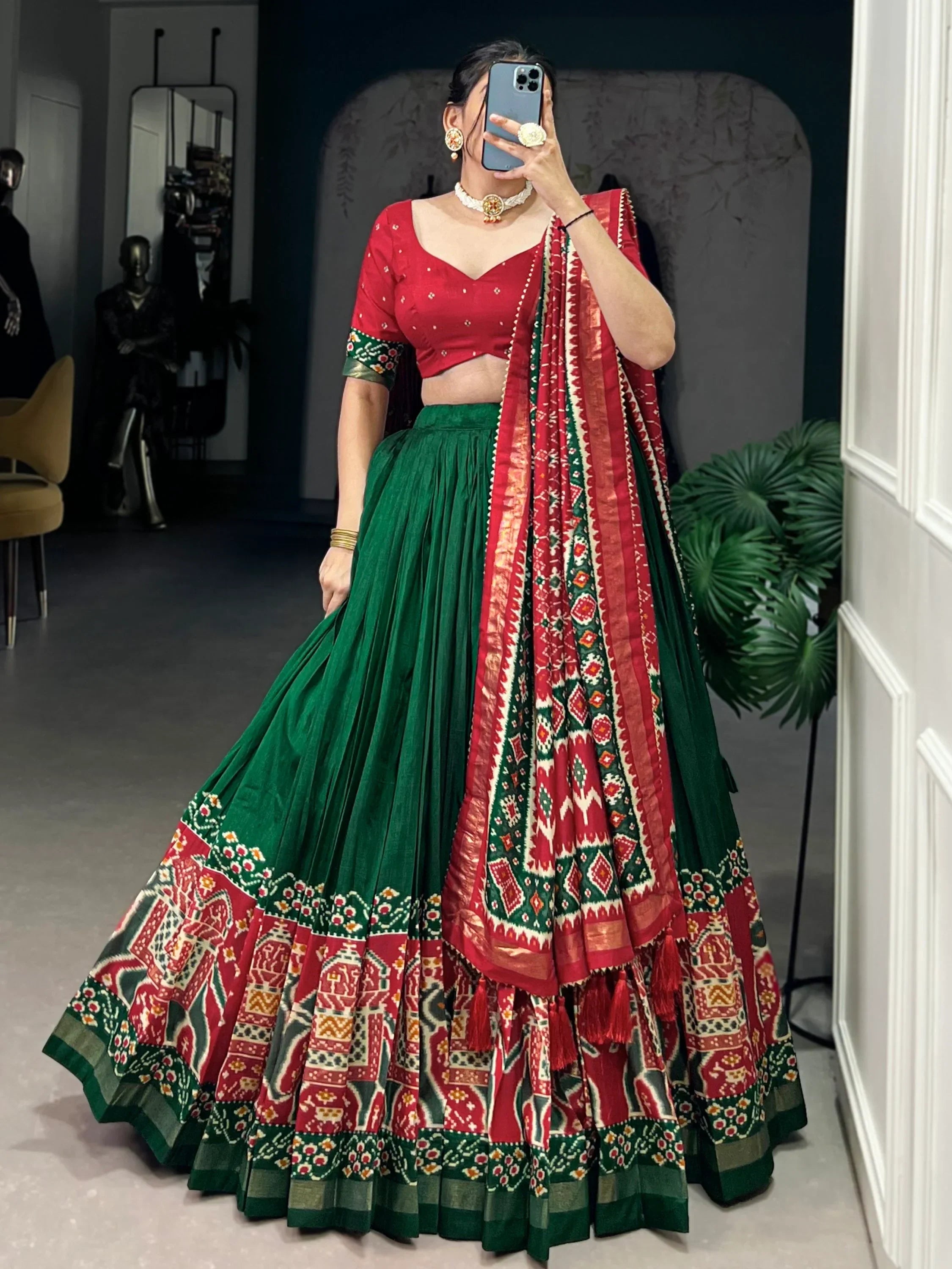 Red and green designer lehenga choli with ethnic print, perfect for Indian weddings and festivals