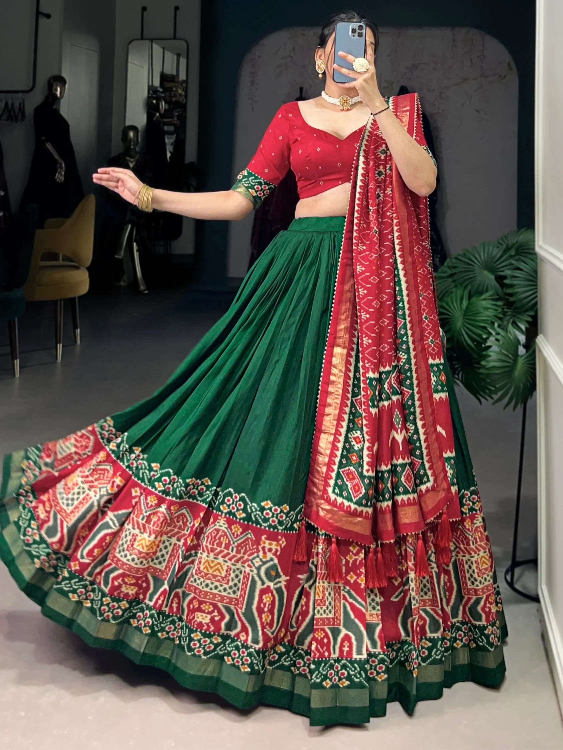 Red and green printed lehenga choli with ethnic motifs, perfect for Indian festive occasions