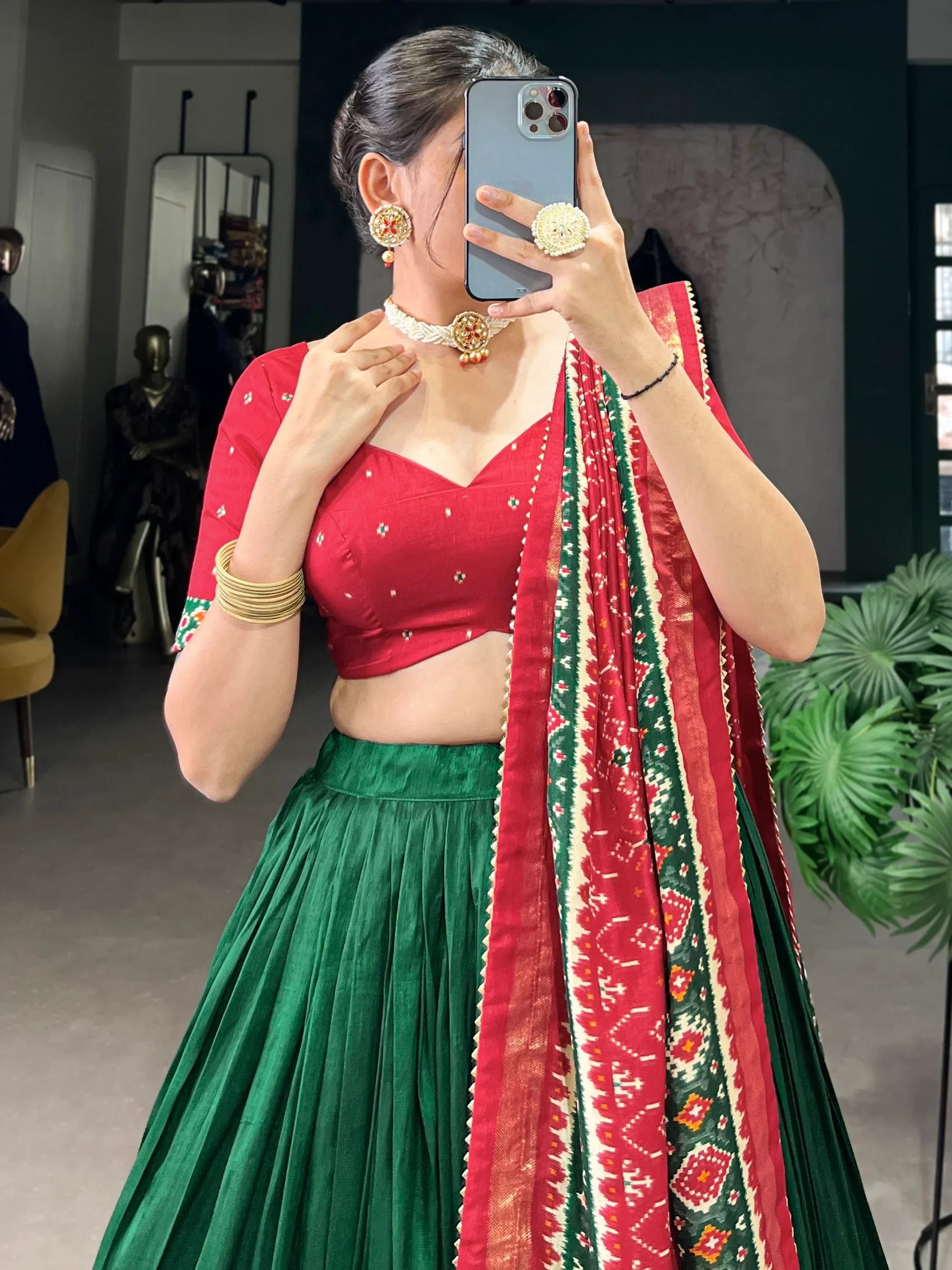 Red and green ethnic lehenga choli with embroidered dupatta, traditional Indian wear for women