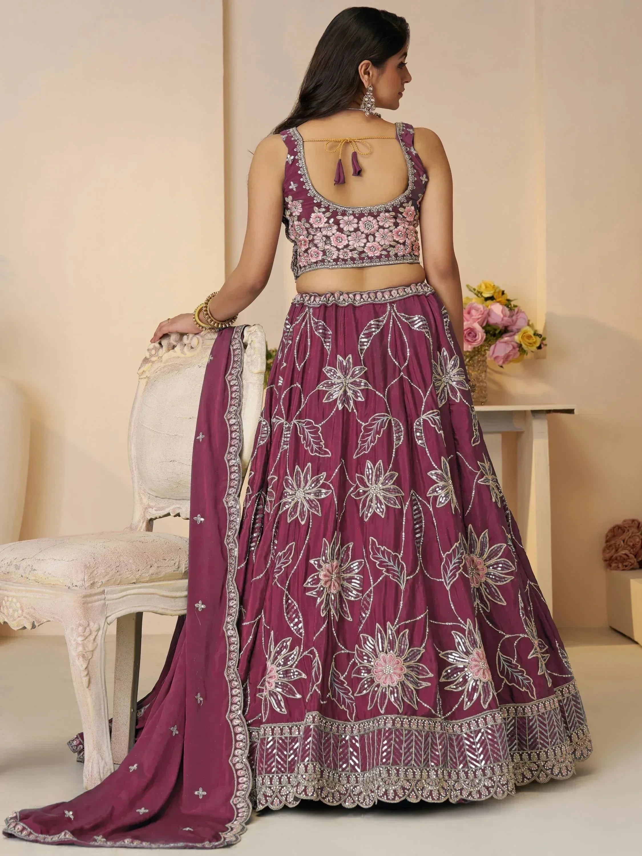 Purple floral embroidered lehenga choli with back tie blouse, perfect for Indian weddings and festive occasions