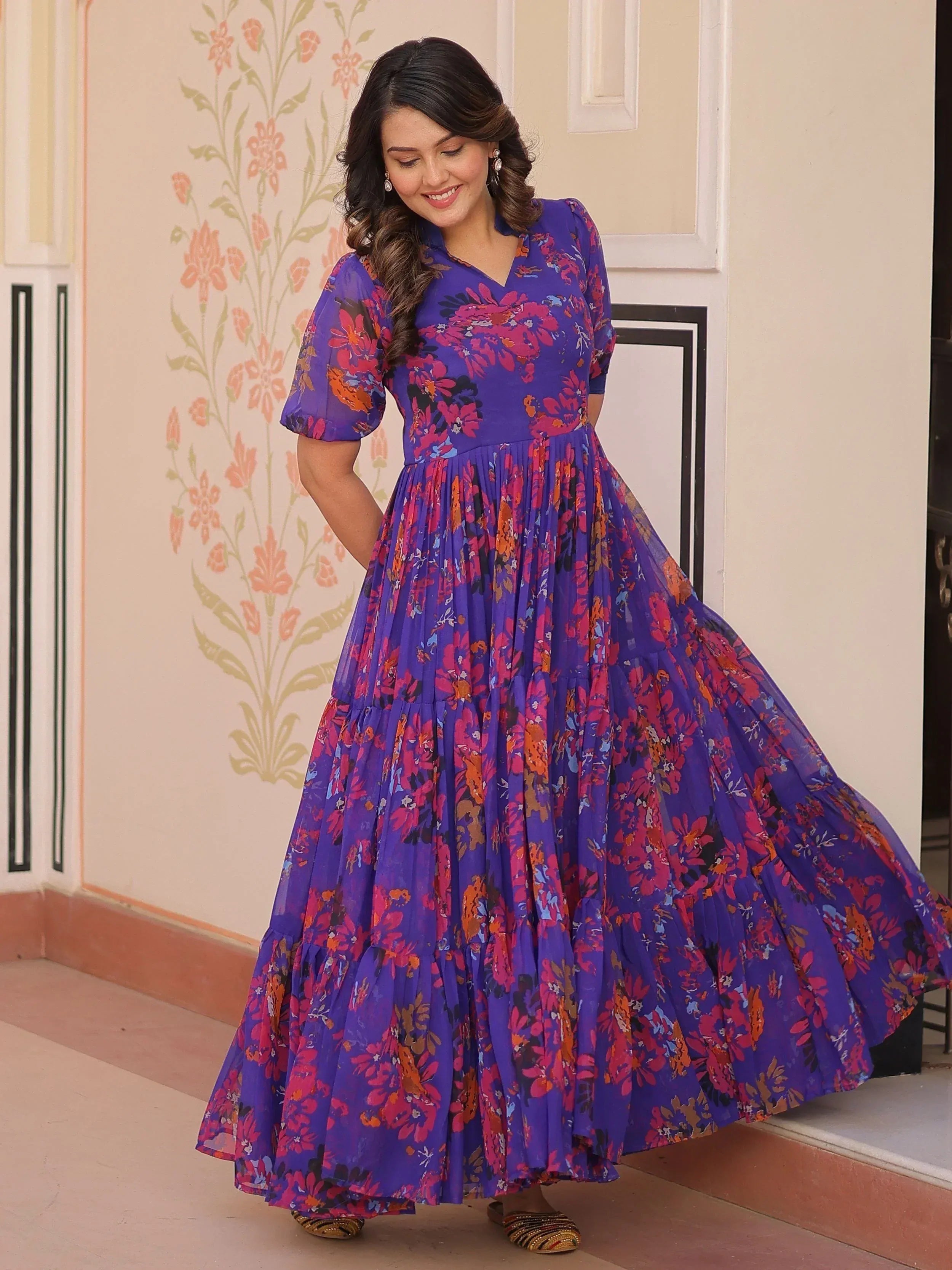 Purple floral ethnic gown with puff sleeves and tiered skirt, perfect for Indian occasions