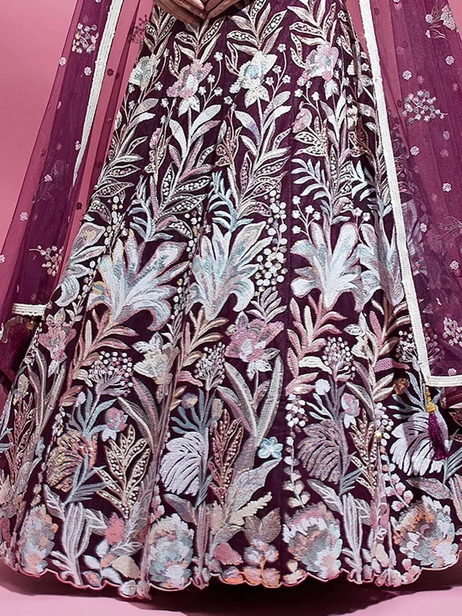 Purple lehenga with intricate floral embroidery and sheer dupatta, perfect for Indian ethnic wear.