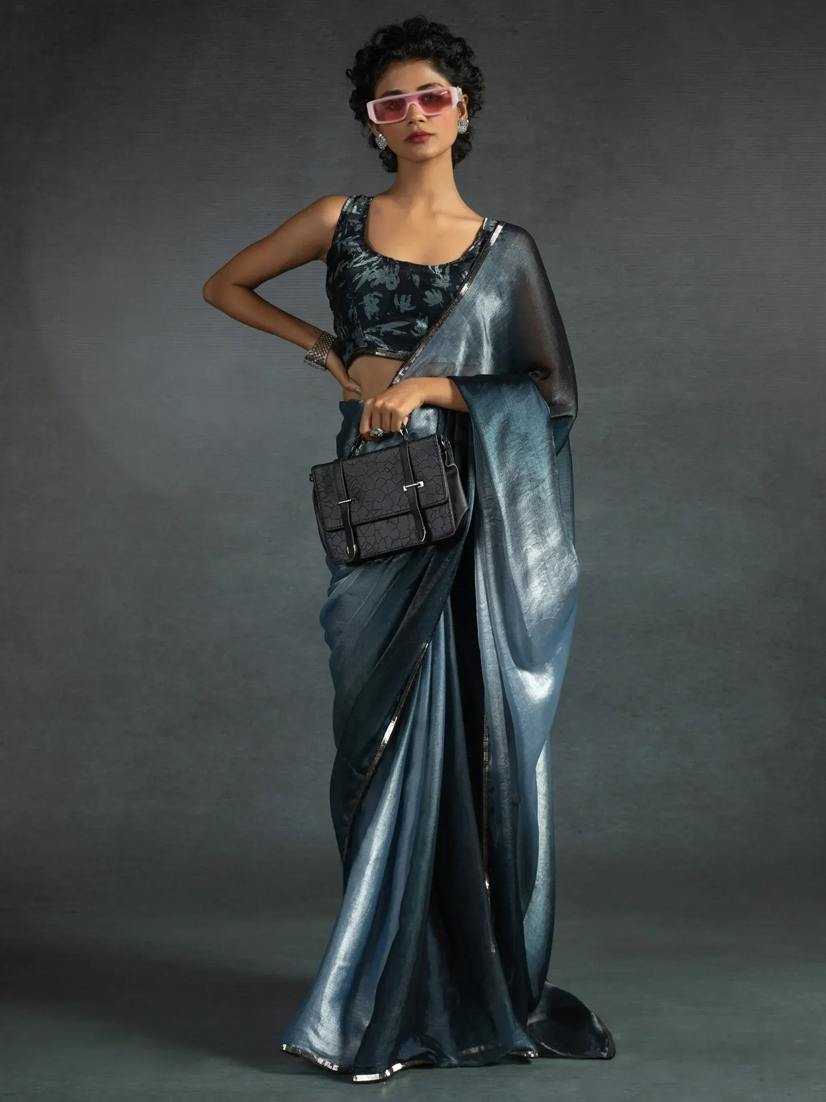 Stylish blue saree with floral blouse, perfect for Indian ethnic wear occasions