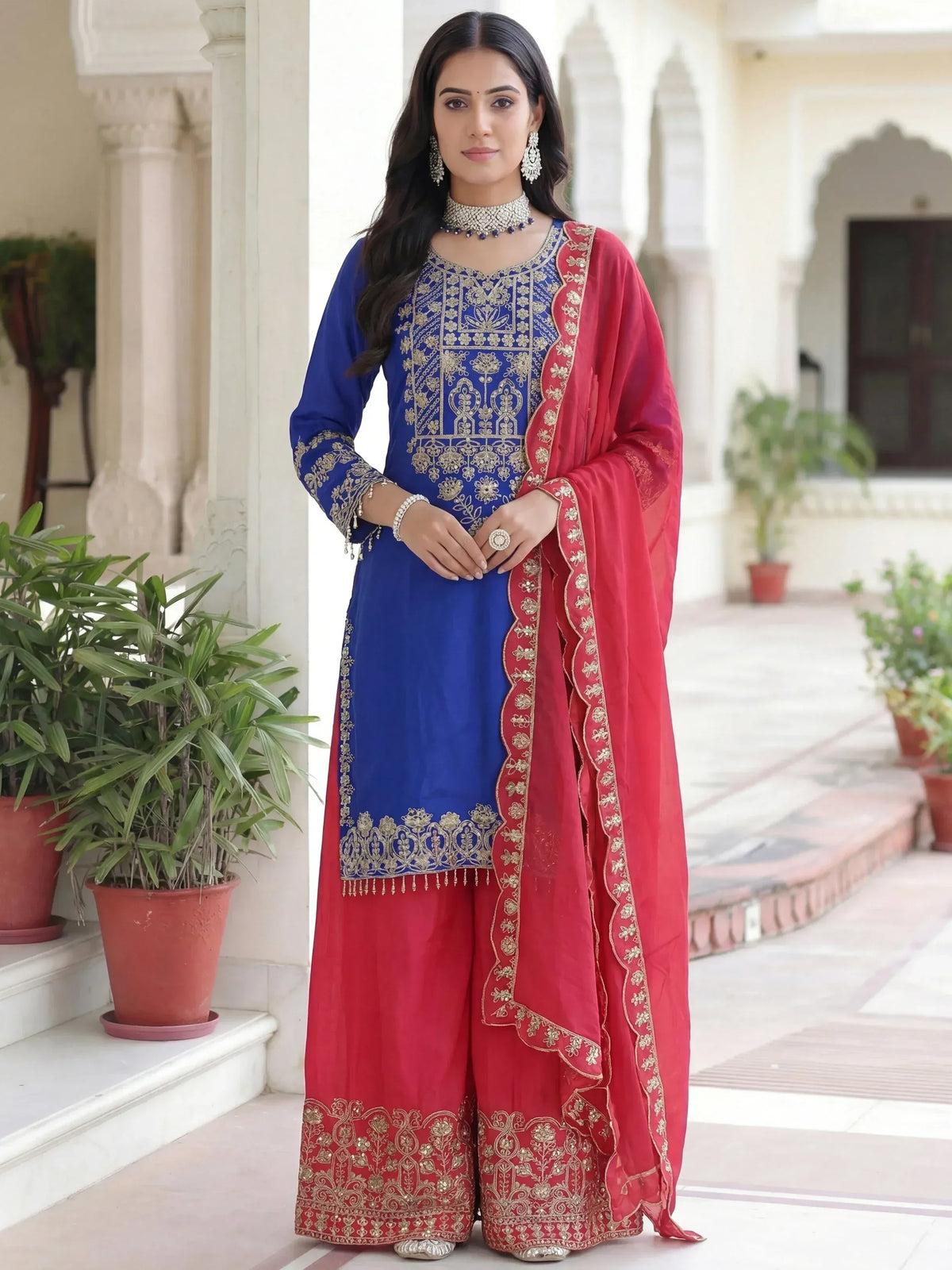 Blue and red embroidered salwar kameez with gold detailing, perfect for Indian ethnic wear occasions