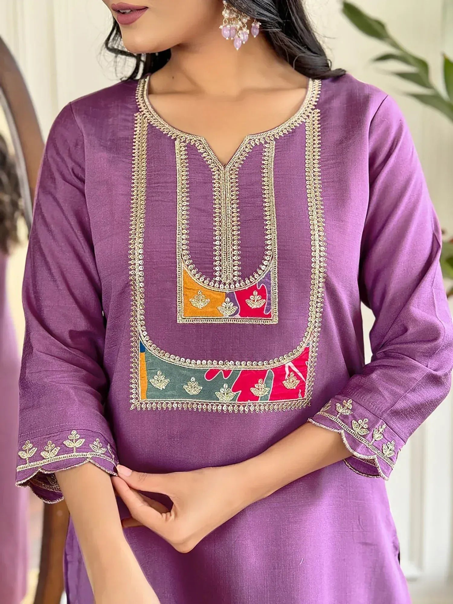 Purple ethnic kurti with gold embroidery and colorful patchwork, perfect for Indian wear