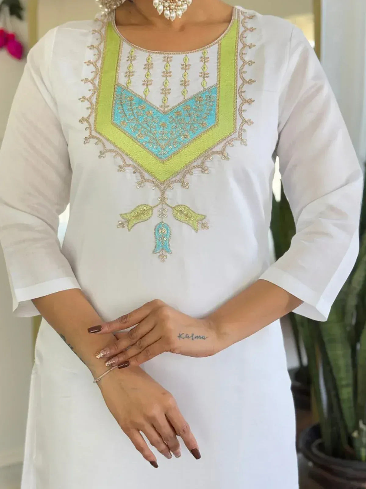 White ethnic kurti with lime and turquoise embroidery, perfect for Indian wear
